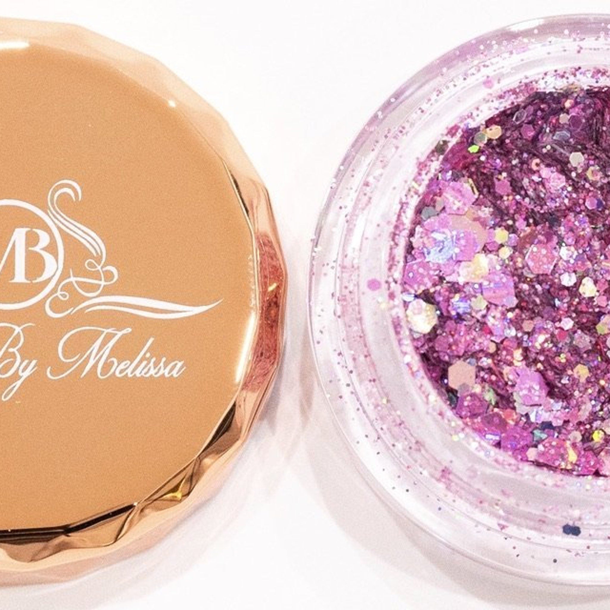 Side view of pink and purple glitter eyeshadow palette showing shimmer texture and compact size