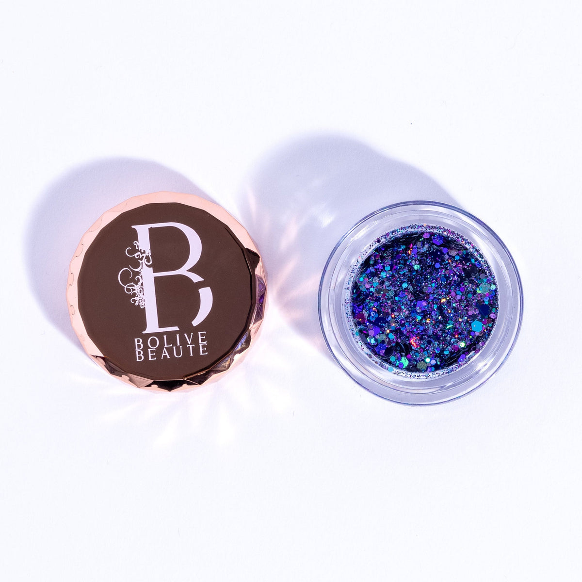 Dual-tone indigo and deep purple glitter eyeshadow palette with shimmer finish in compact case