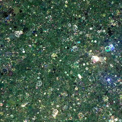 Close-up of mint green glitter eyeshadow pot showing vibrant shimmer particles in Mojito shade