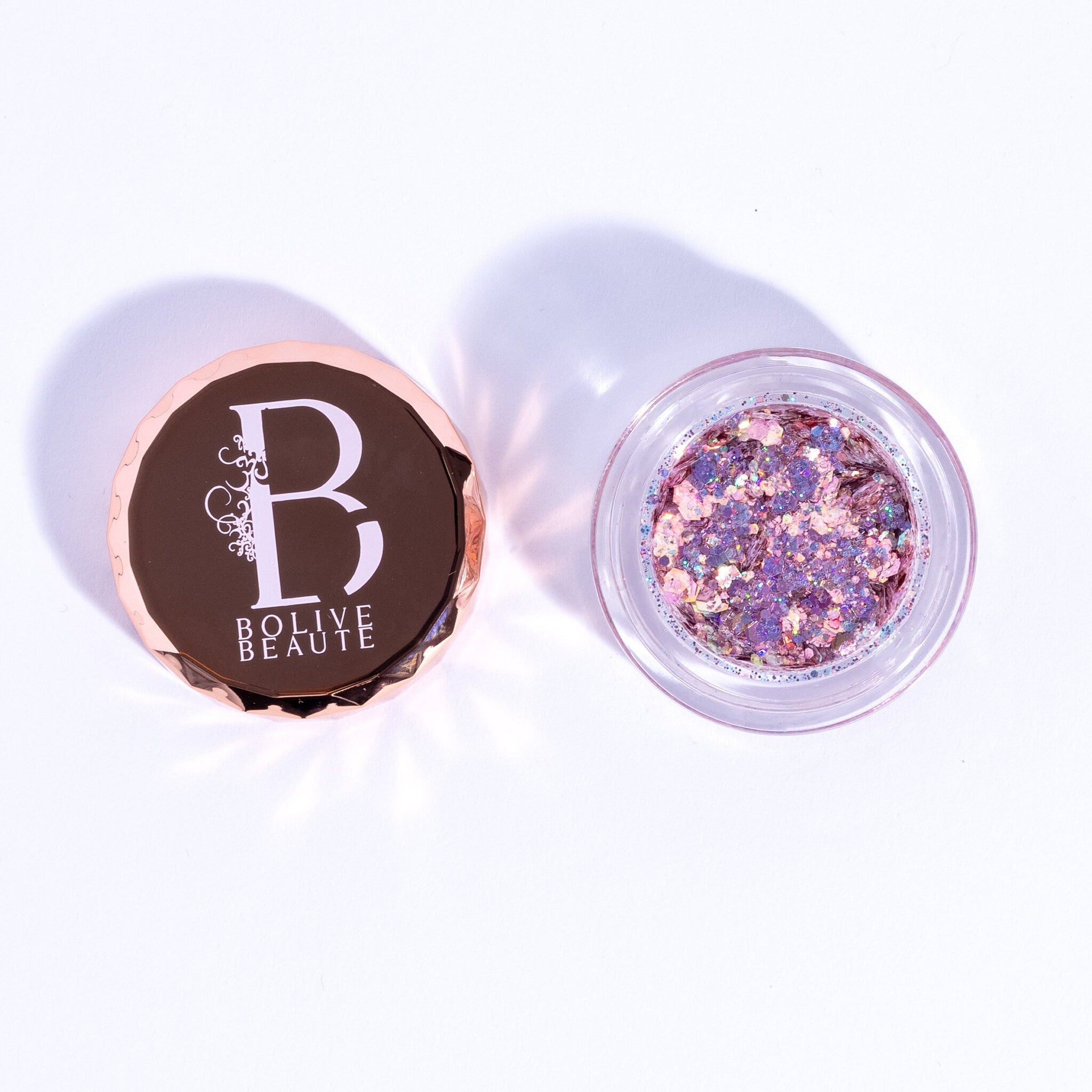 Rosé pink glitter eyeshadow in compact with reflective shimmer and soft gradient finish