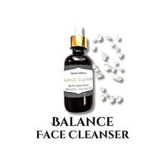 Face cleanser bottle with gold cap, dark glass, and clear crystals around it
