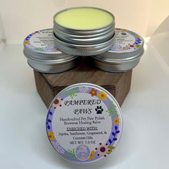 Pet paw healing salve in silver tins with floral labels, CrystalHealingbyTay brand visible