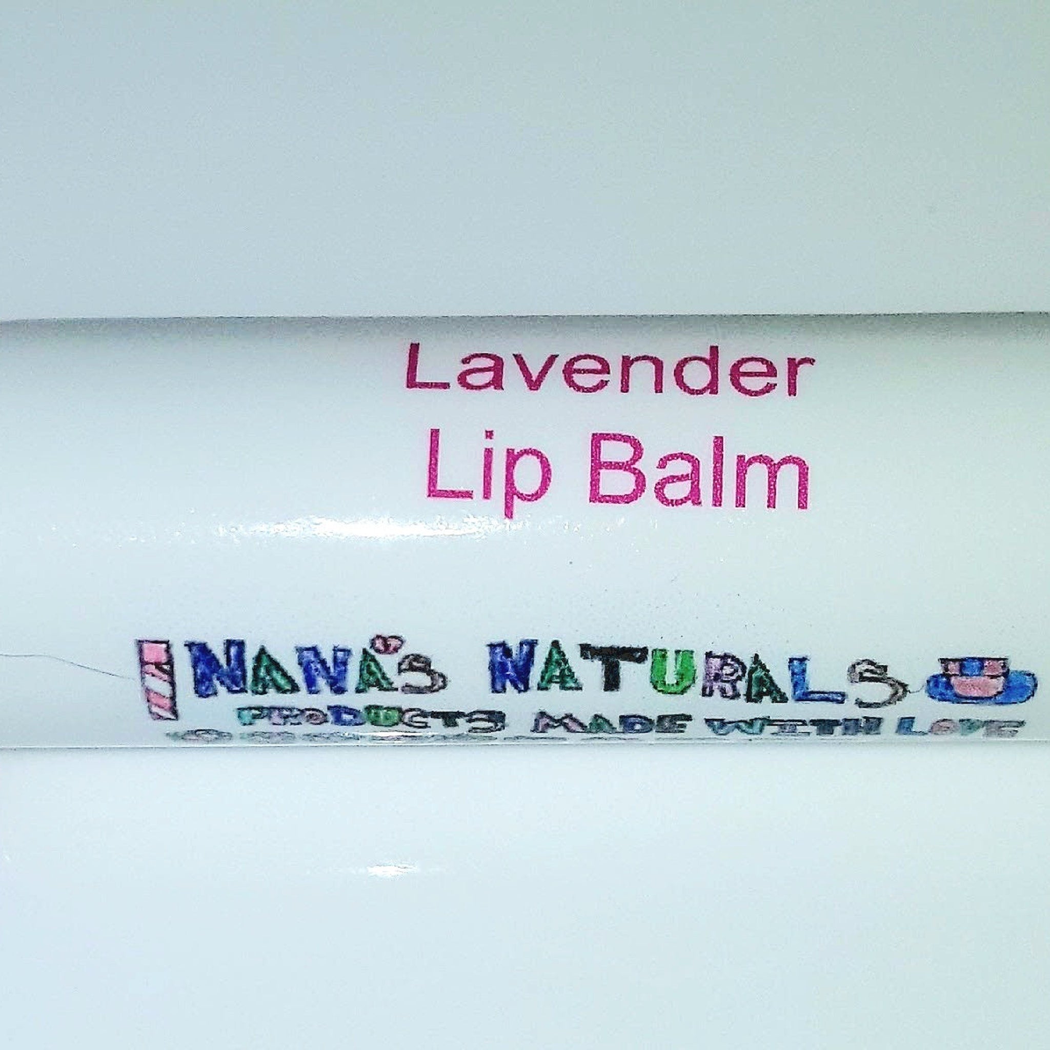 Lavender lip balm with pink text on white background, "Nana's Naturals" brand visible