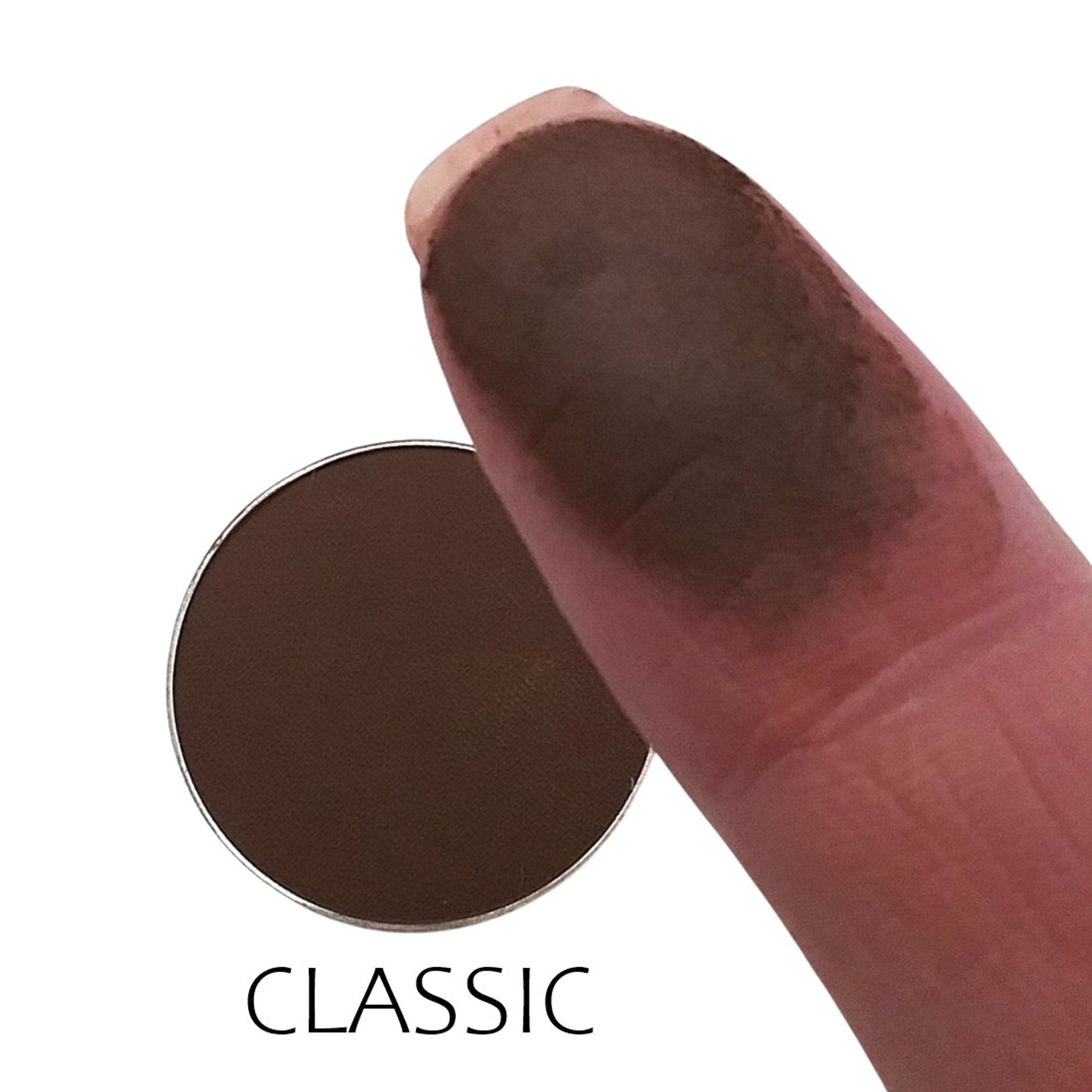 Close-up of matte eyeshadow pan showing smooth, velvety texture in a neutral classic shade