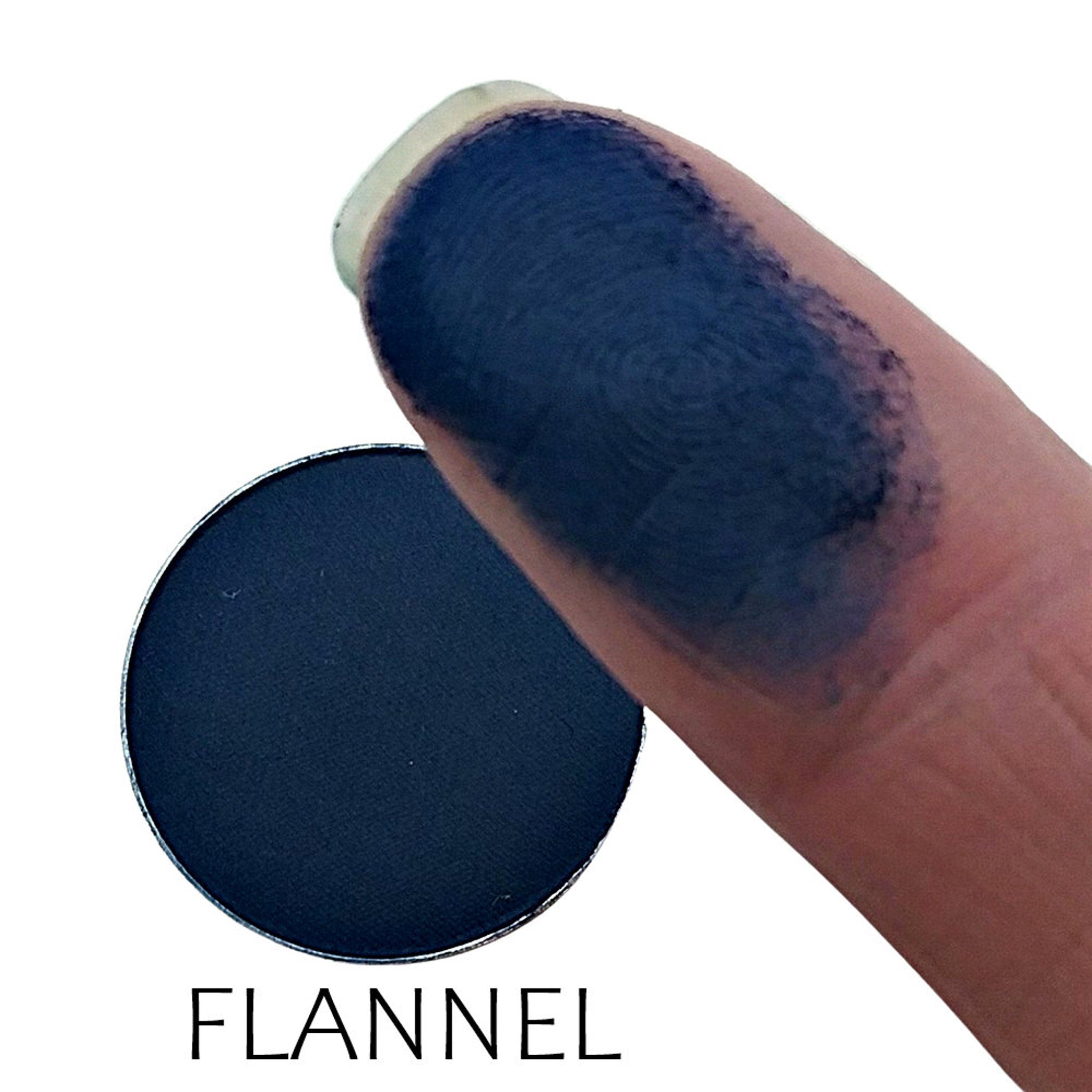 Close-up of matte flannel eyeshadow pan showing soft, velvety texture in warm taupe shade