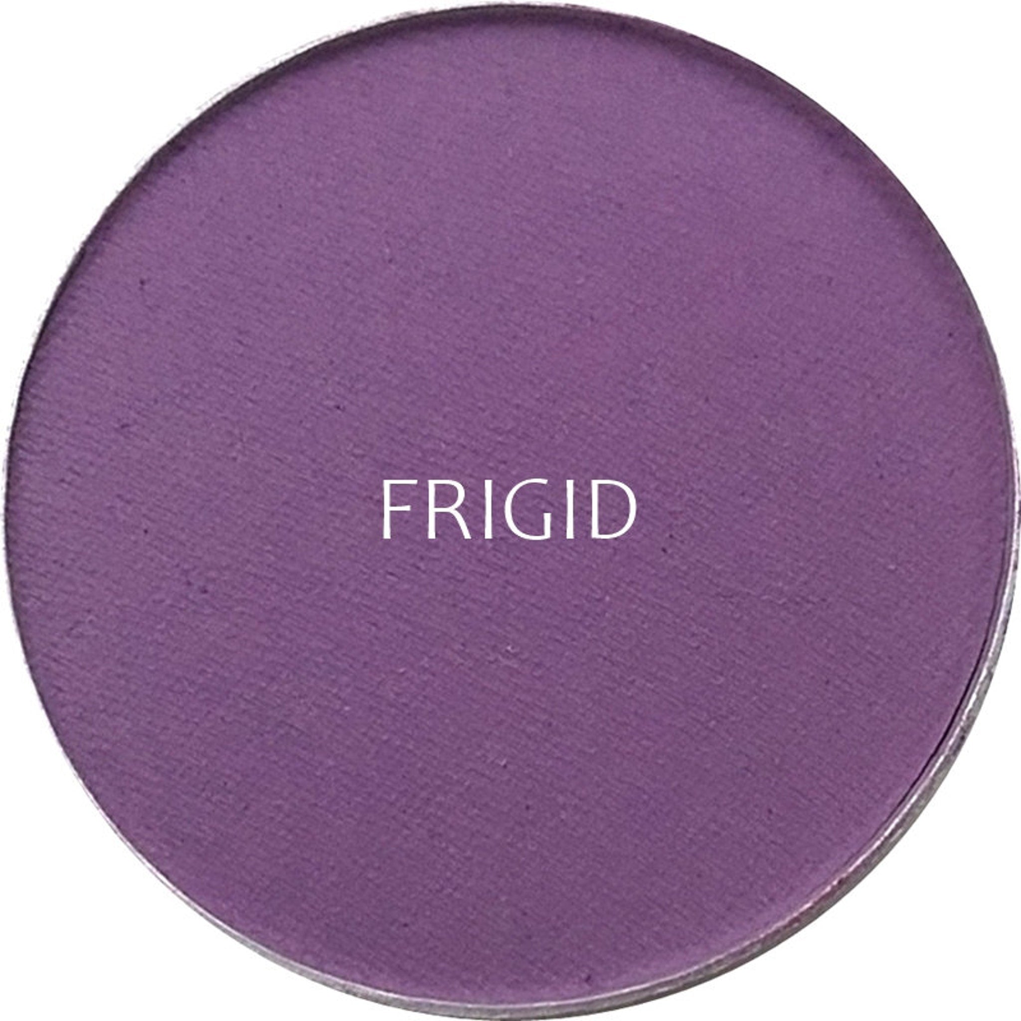 Side view of matte frigid eyeshadow pan showing cool-toned powder texture and compact case edges