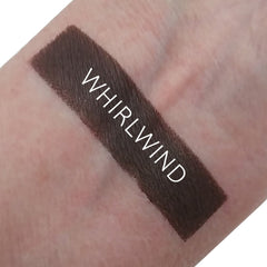 Single matte whirlwind eyeshadow pan in a neutral taupe shade with smooth, velvety texture and minimalist black packaging.
