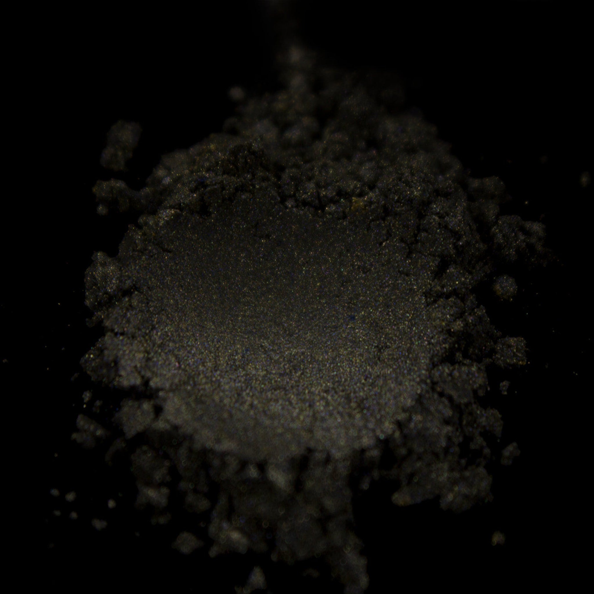 Side view of vegan taupe shimmer eye shadow compact showing pressed pigment texture and cool neutral tone
