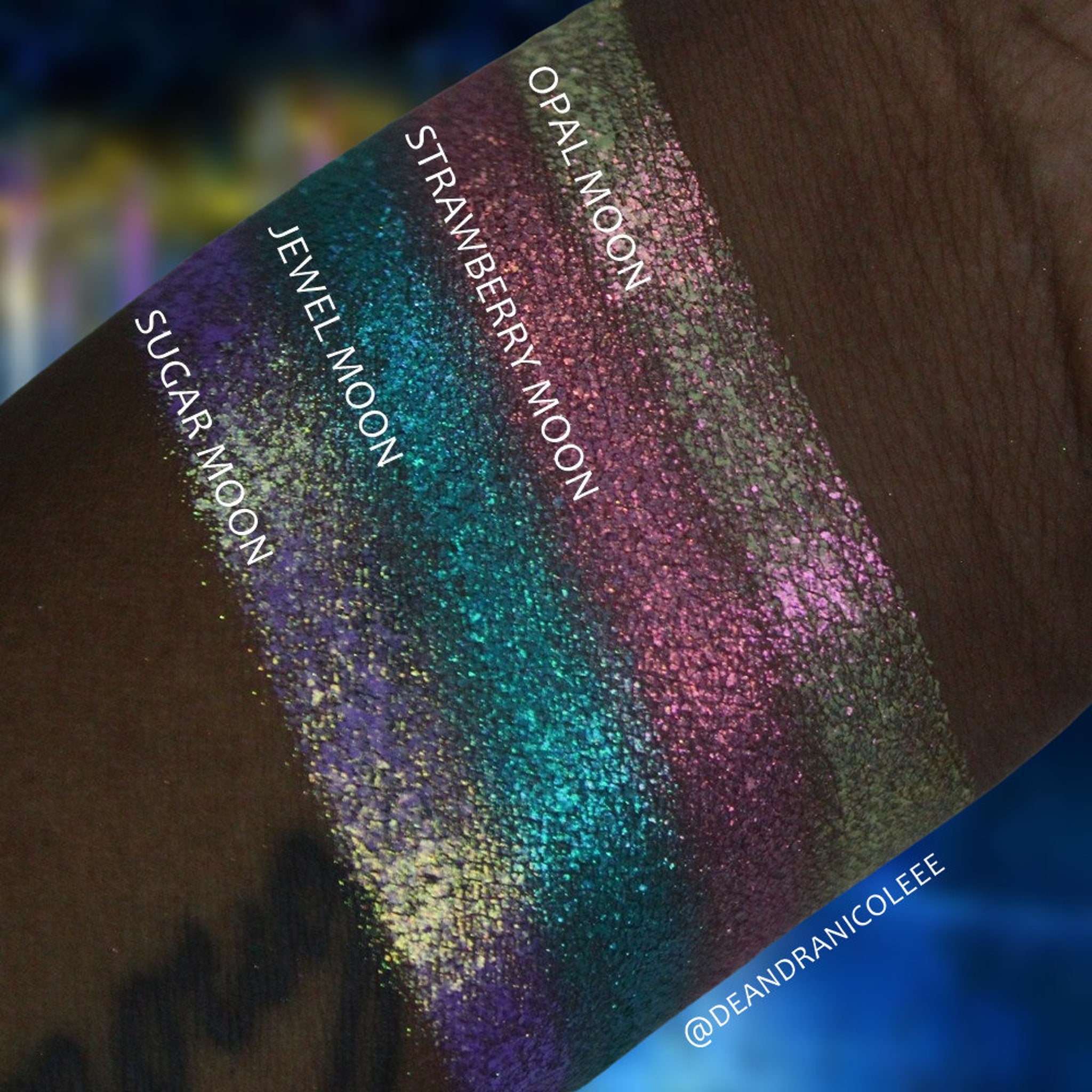 Side view of Chrome Shifting Strawberry Moon eyeshadow pot showing metallic pink shift and compact round case