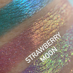 Side view of Chrome Shifting Strawberry Moon eyeshadow palette showing iridescent pink and gold shift in compact case
