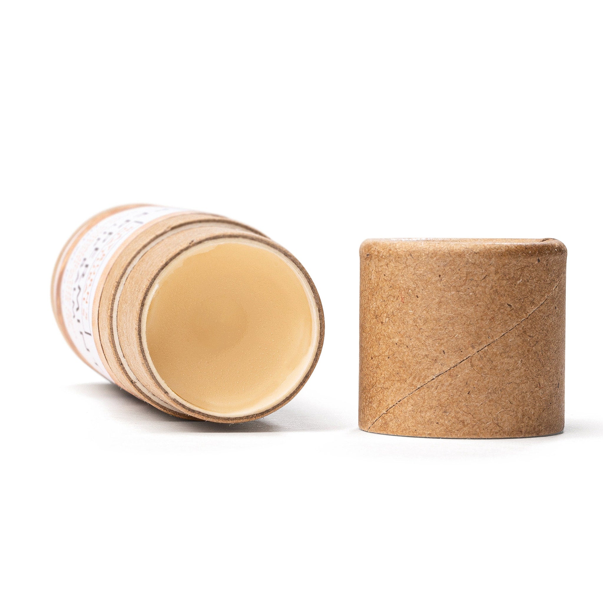 Deodorant stick in tan cardboard tube with cream-colored balm, Rayburn's Naturals branding visible