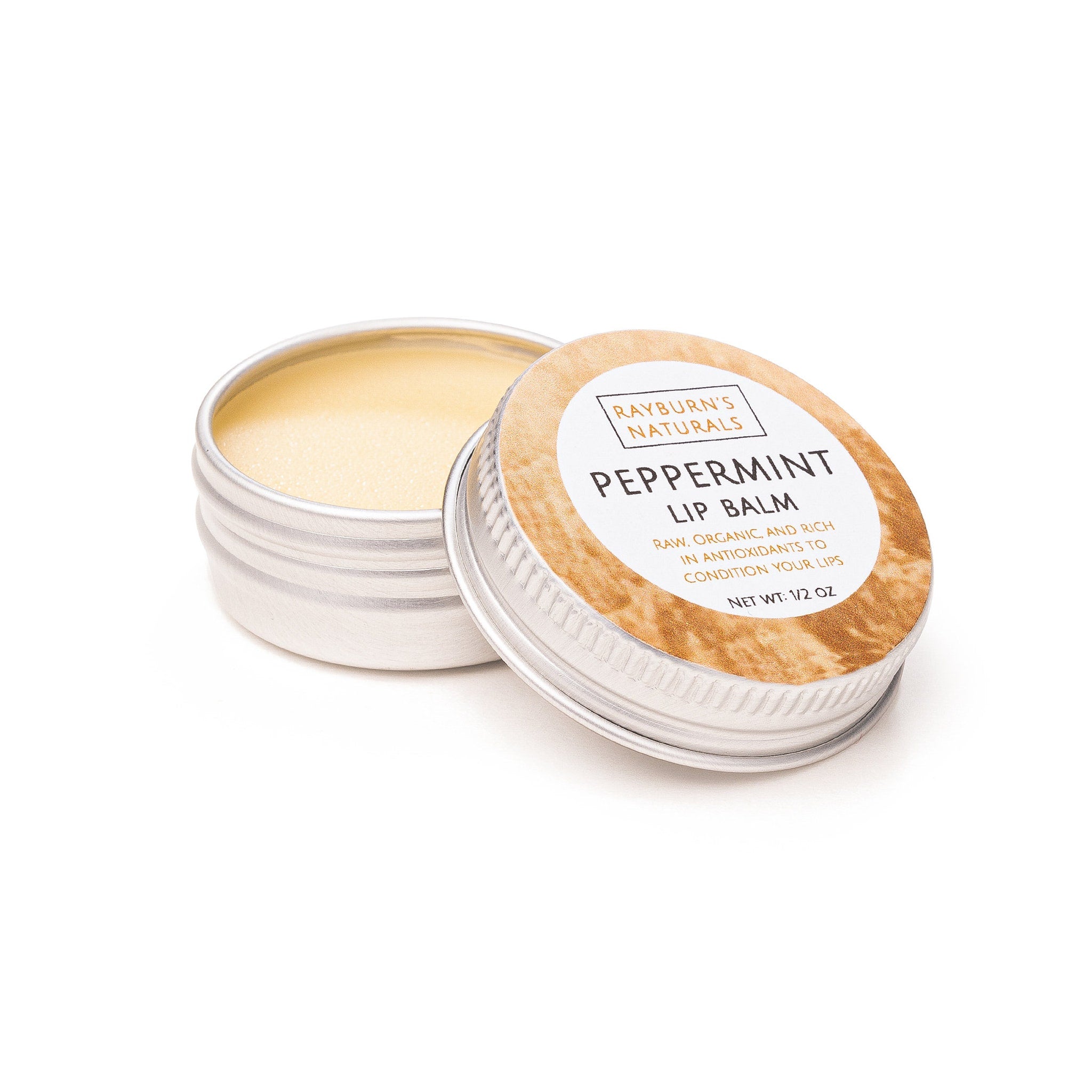 Lip balm in silver tin with tan label, Rayburn's Naturals peppermint flavor, opened to show product