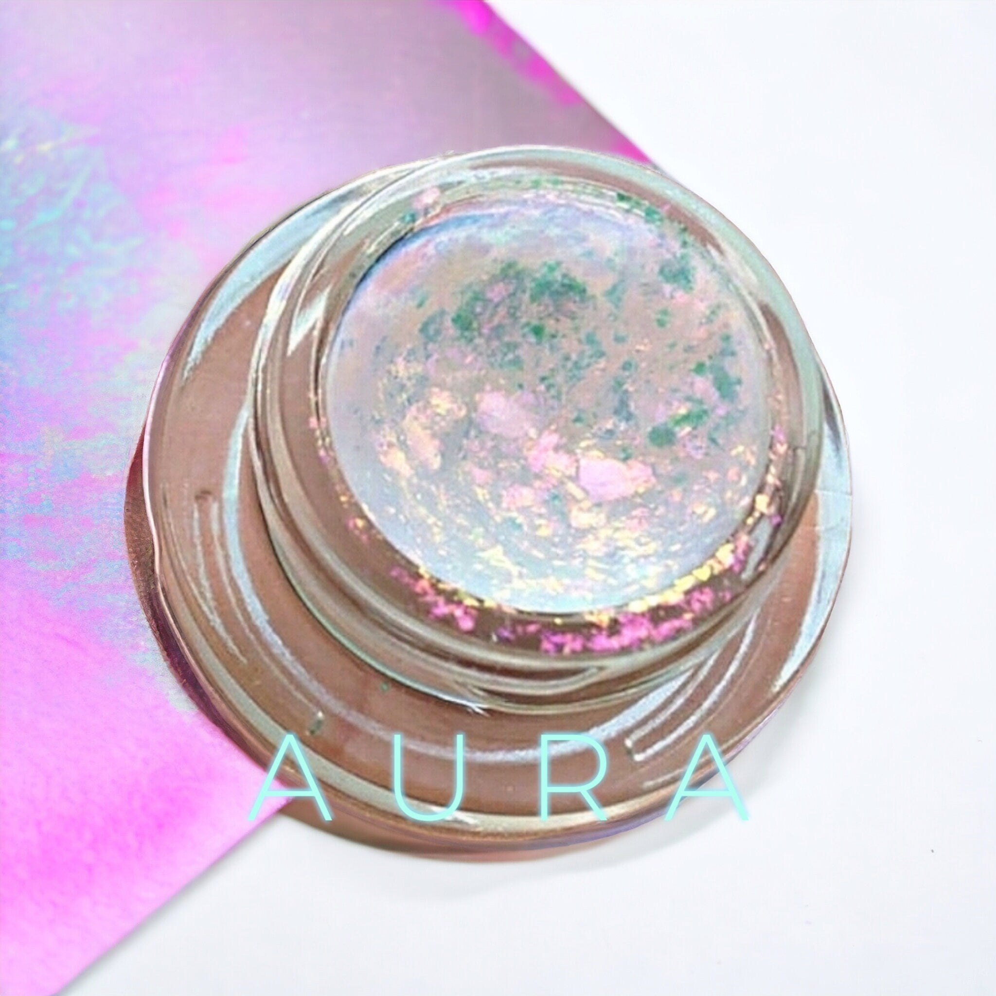 Side view of creamy chrome eyeshadow palette showing reflective metallic shades in compact case
