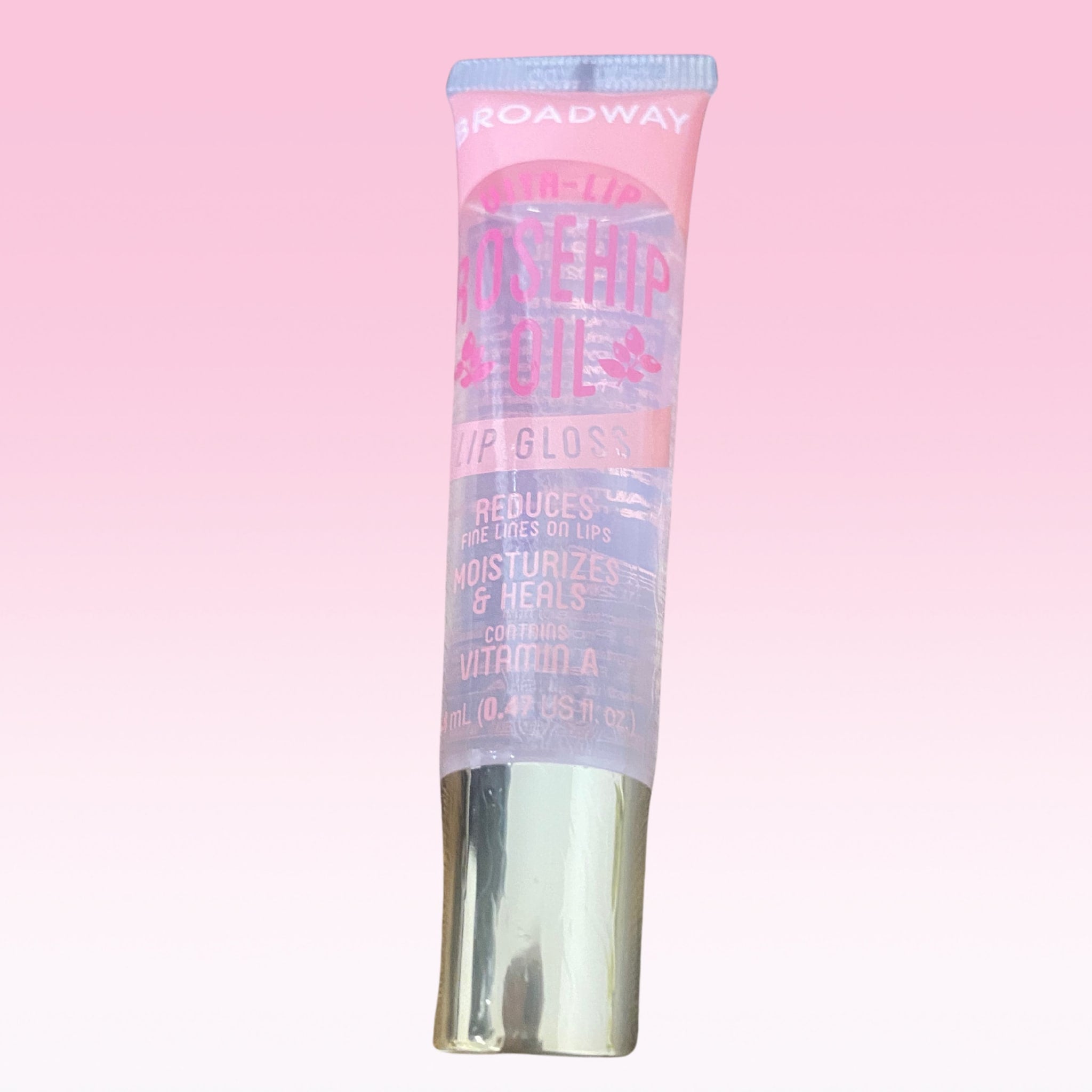 Lip gloss tube with pink and clear body, silver cap, and Broadway Vita Soft branding