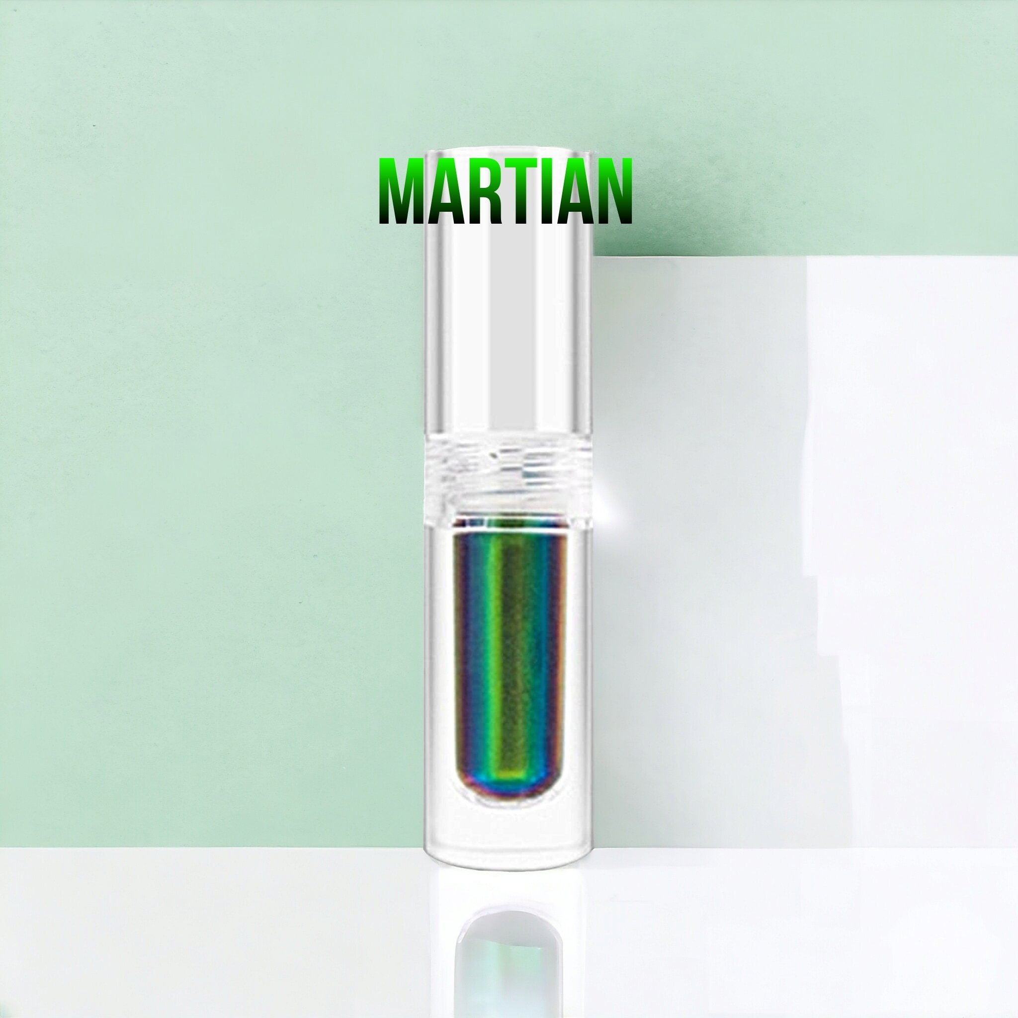 Close-up of multichrome liquid eyeshadow shifting between emerald green and sapphire blue hues