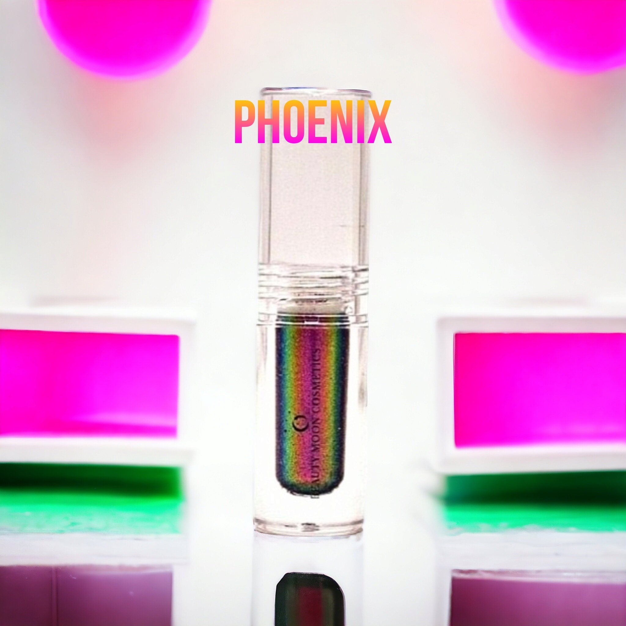 Gold-to-green multichrome liquid eyeshadow bottle with sleek dropper applicator on marble surface