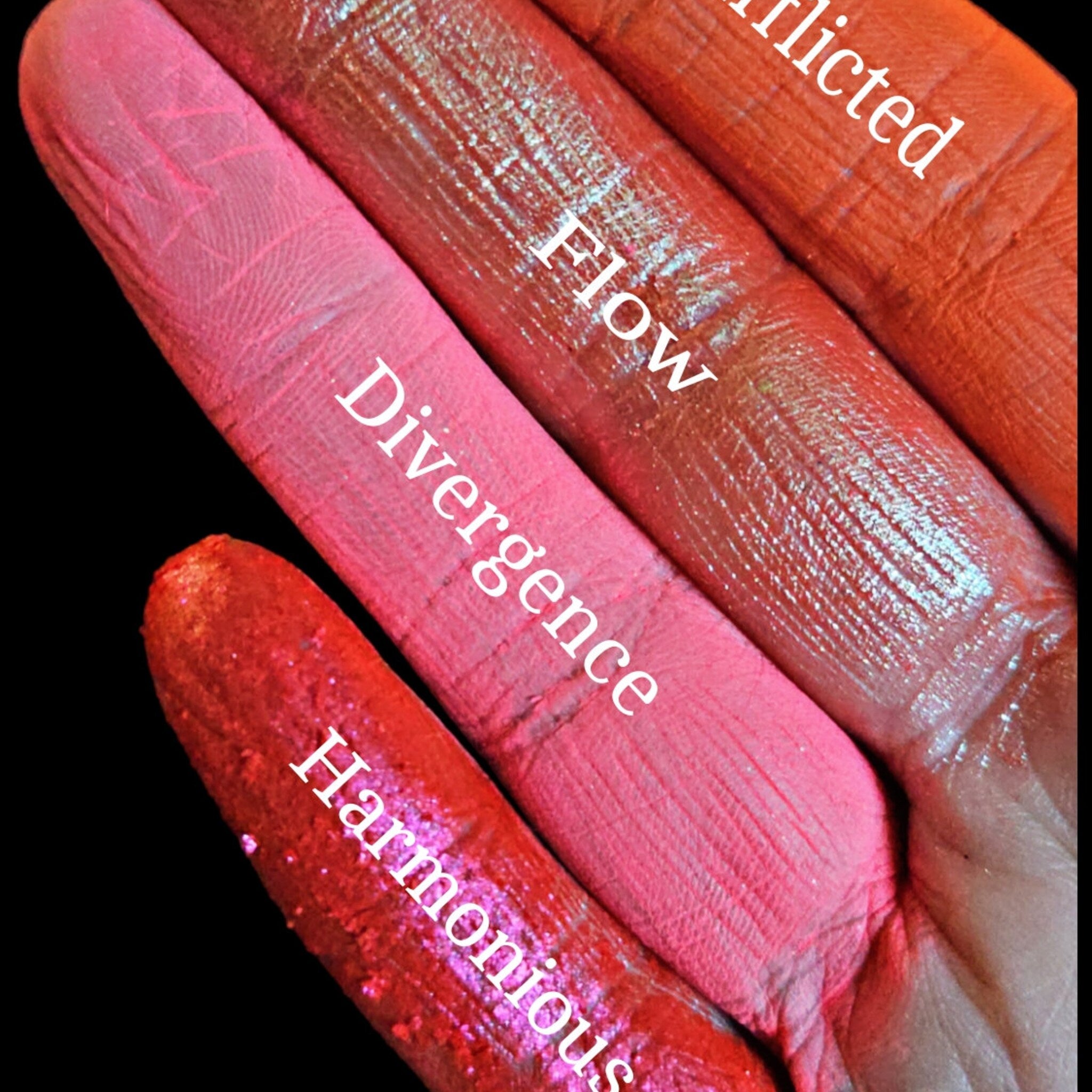 Side view of Divergence palette showing gradient of matte and shimmer eyeshadow pans in warm bronze tones