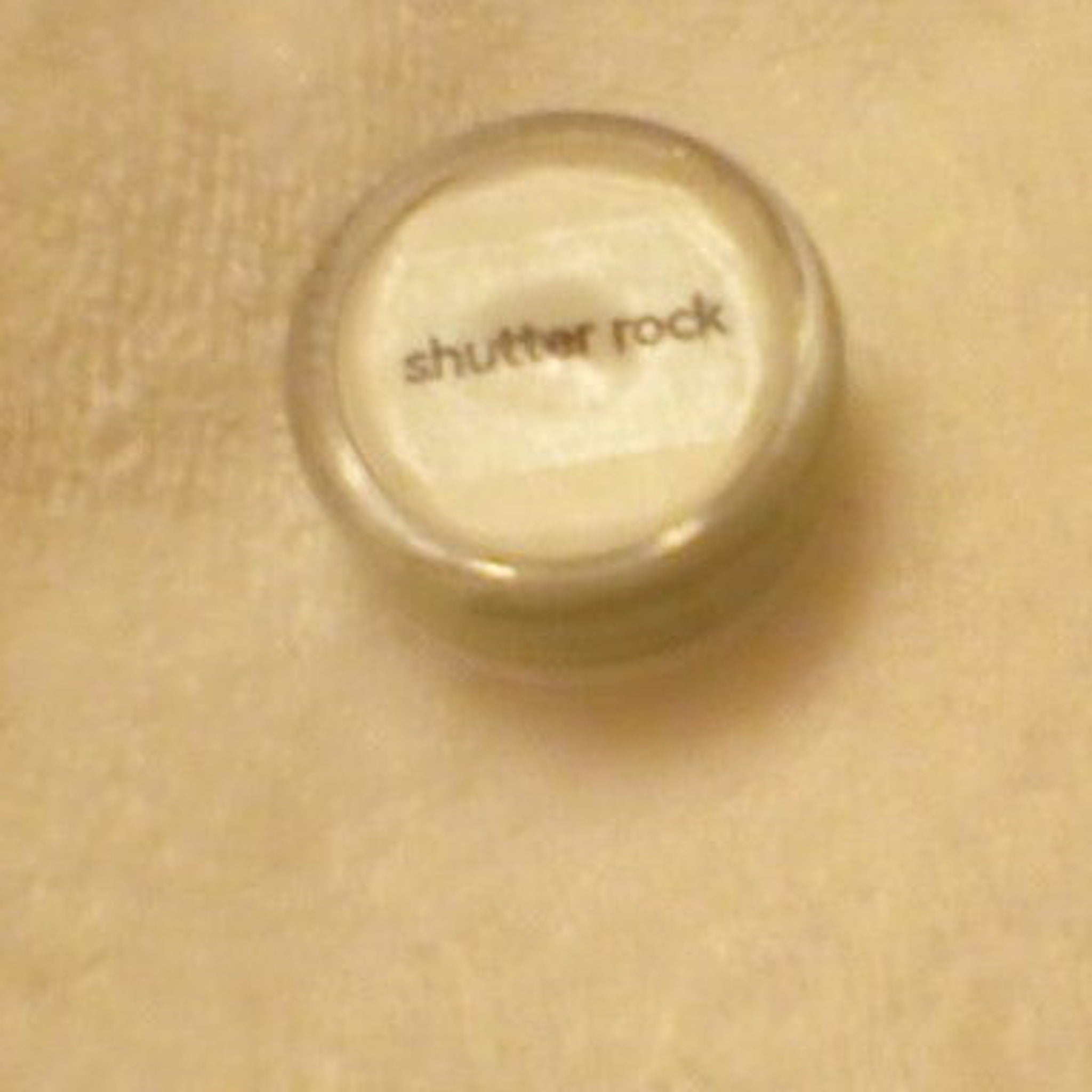 Close-up of pressed powder eye shadow showing smooth texture and rich pigment in compact palette