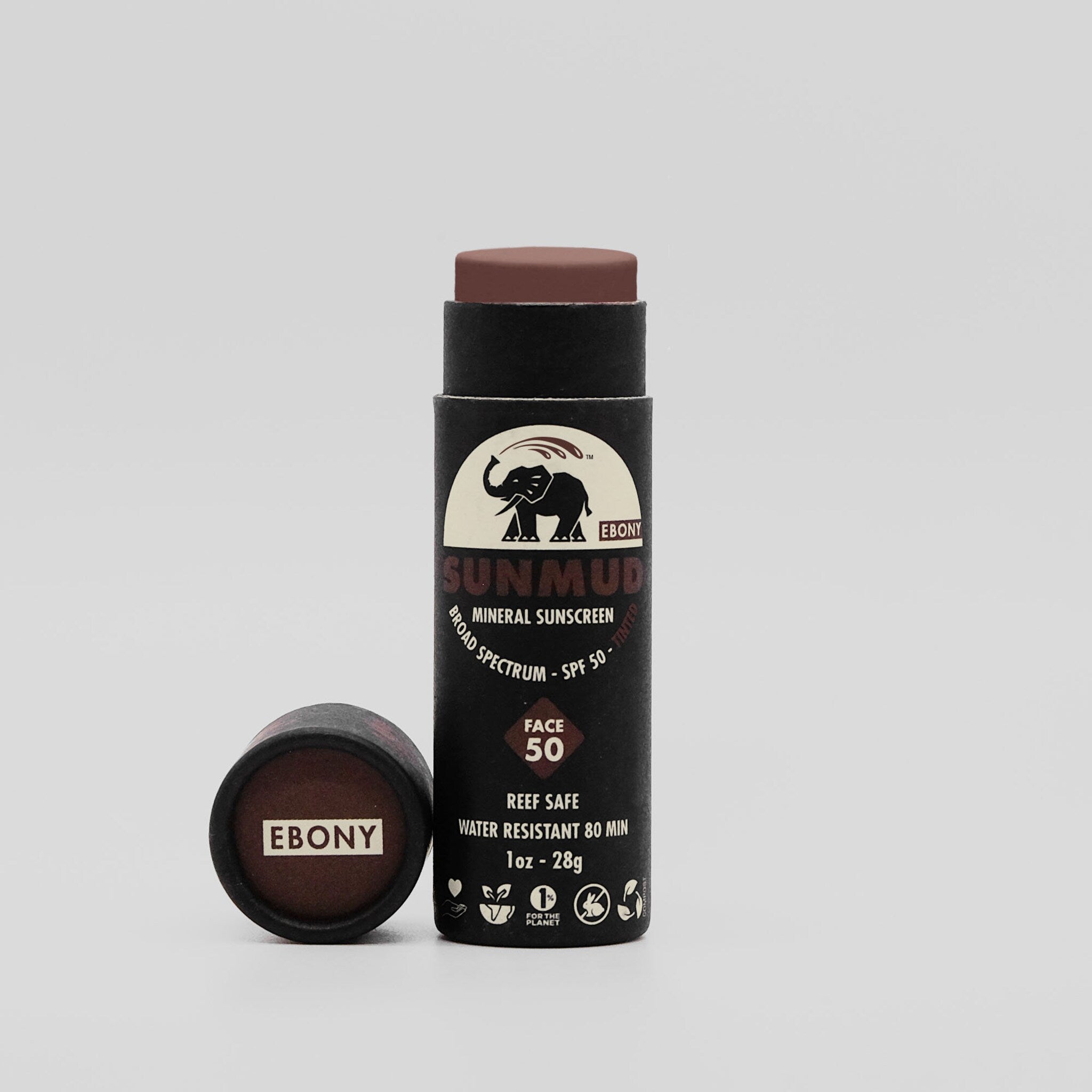 Sunscreen stick with brown tinted top, black tube, and EBONY brand text