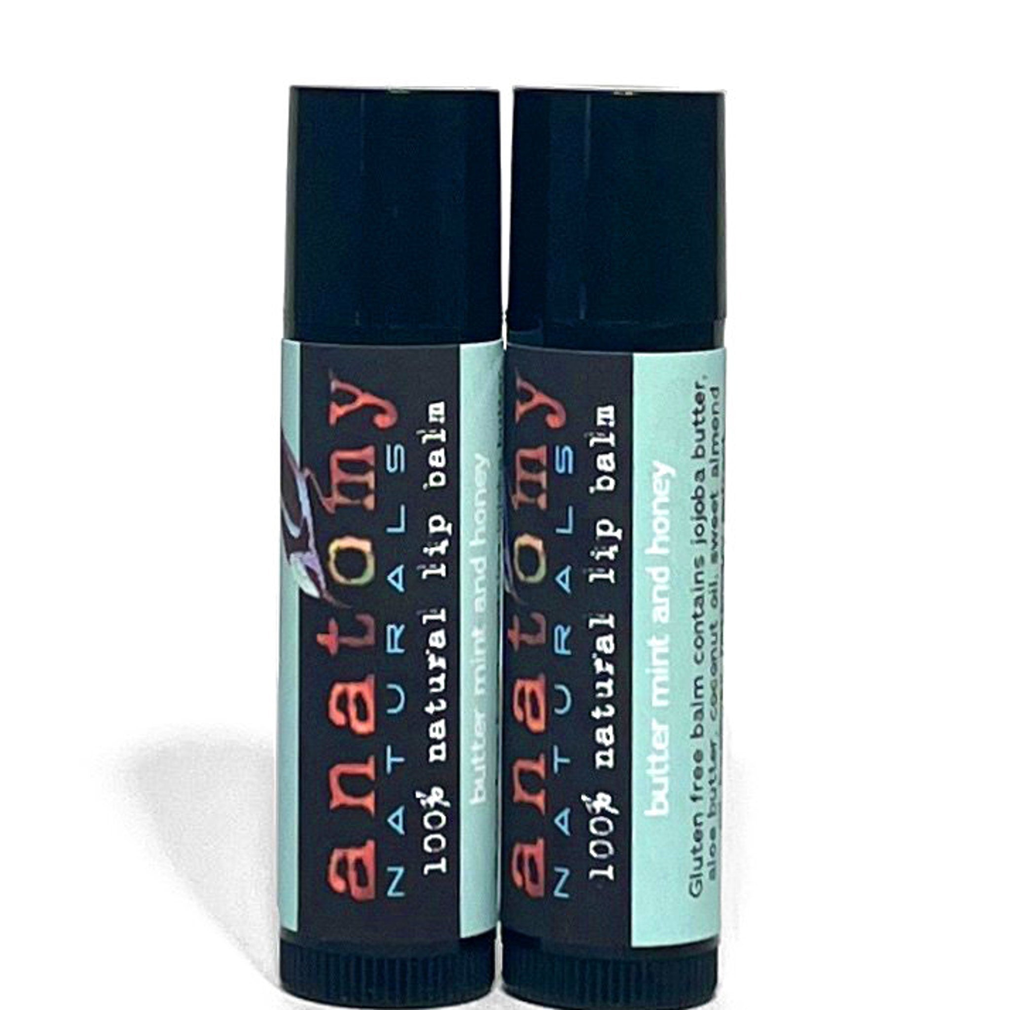 Lip balm tubes with black caps, Anatomy Naturals branding, and mint and honey label