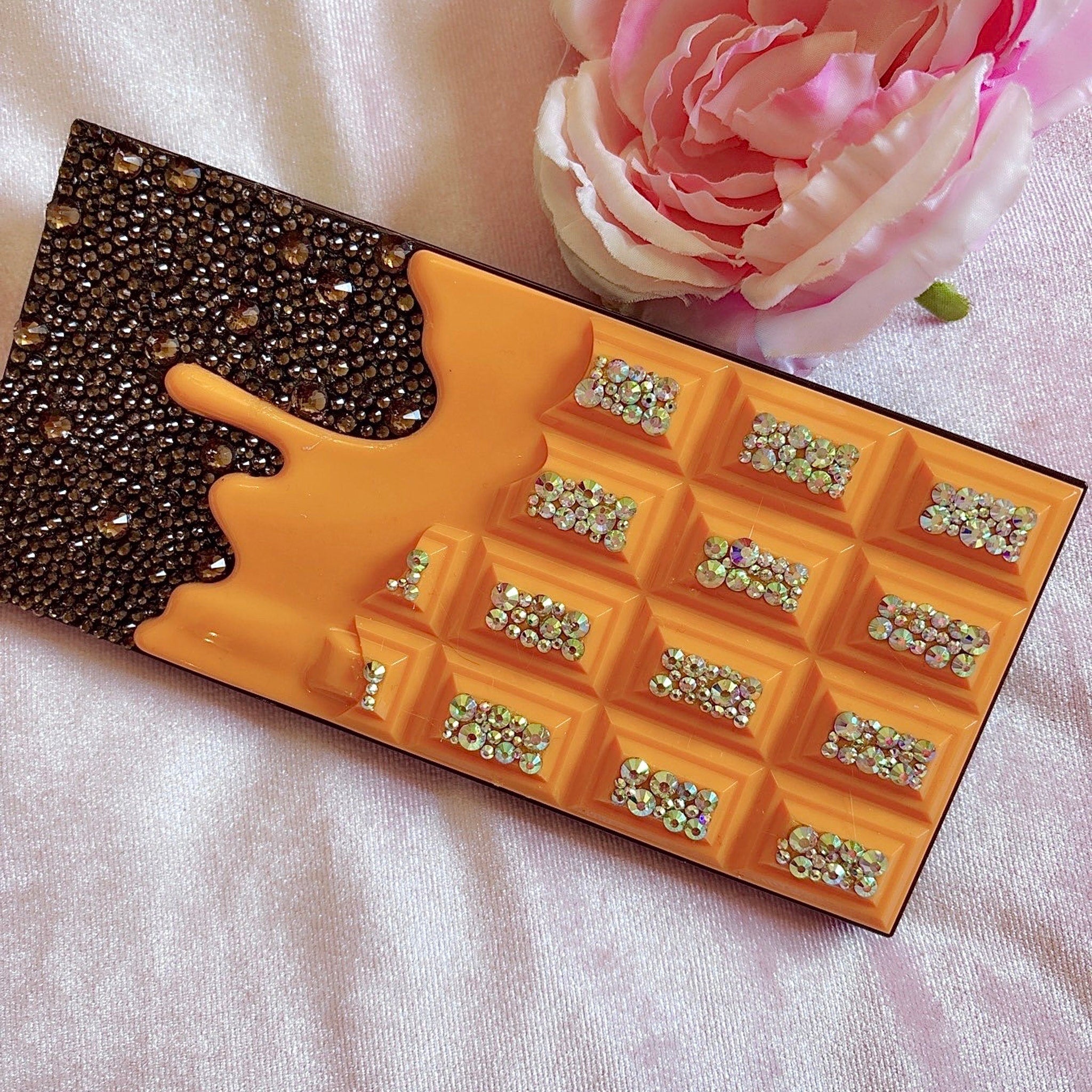 Side view of Chocolate Bar Eyeshadow Palette showing blinged glam shades with shimmer textures and gold detailing