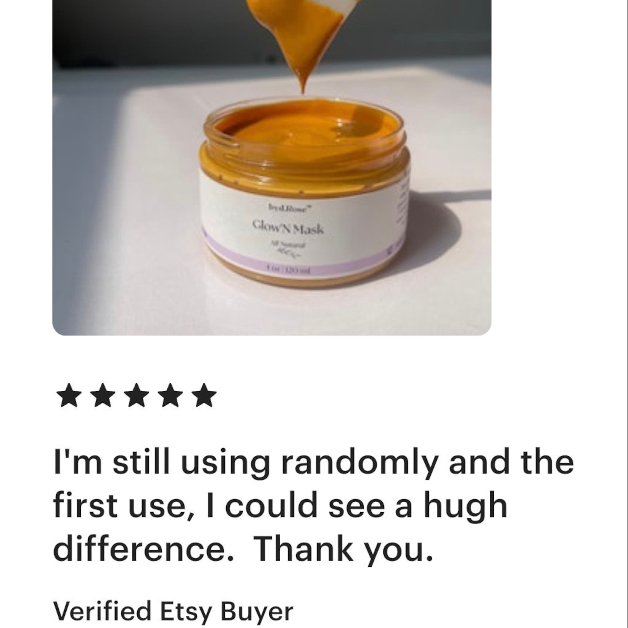 Face mask jar with orange contents, white label, and "Glow N Mask" text visible