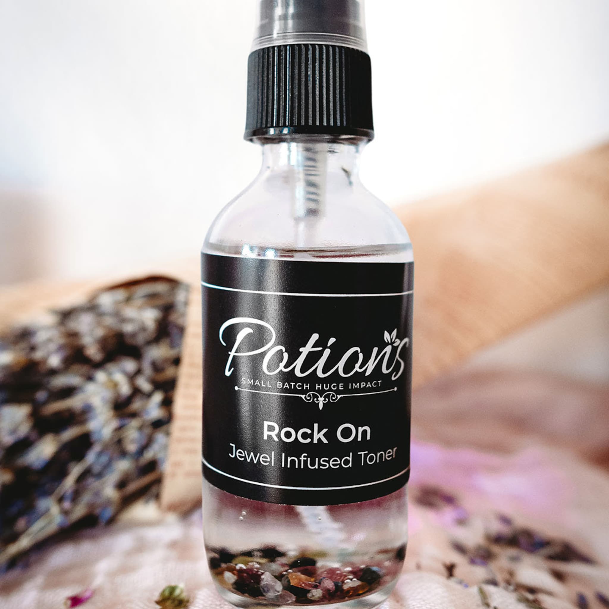 Toner bottle with black label, clear glass, and "Potion's" text