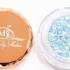 Close-up of celestial sky blue glitter eyeshadow with sparkling metallic finish in compact pan