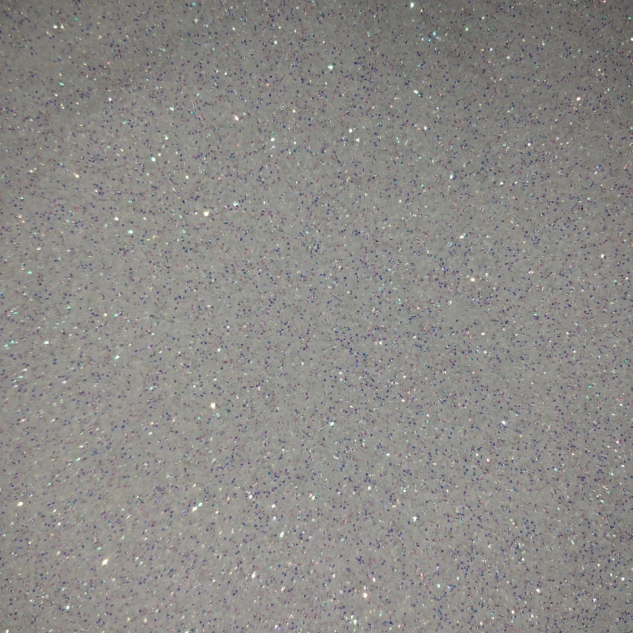 Close-up of sparkling bronze eyeshadow palette with shimmer particles and smooth pressed powder texture