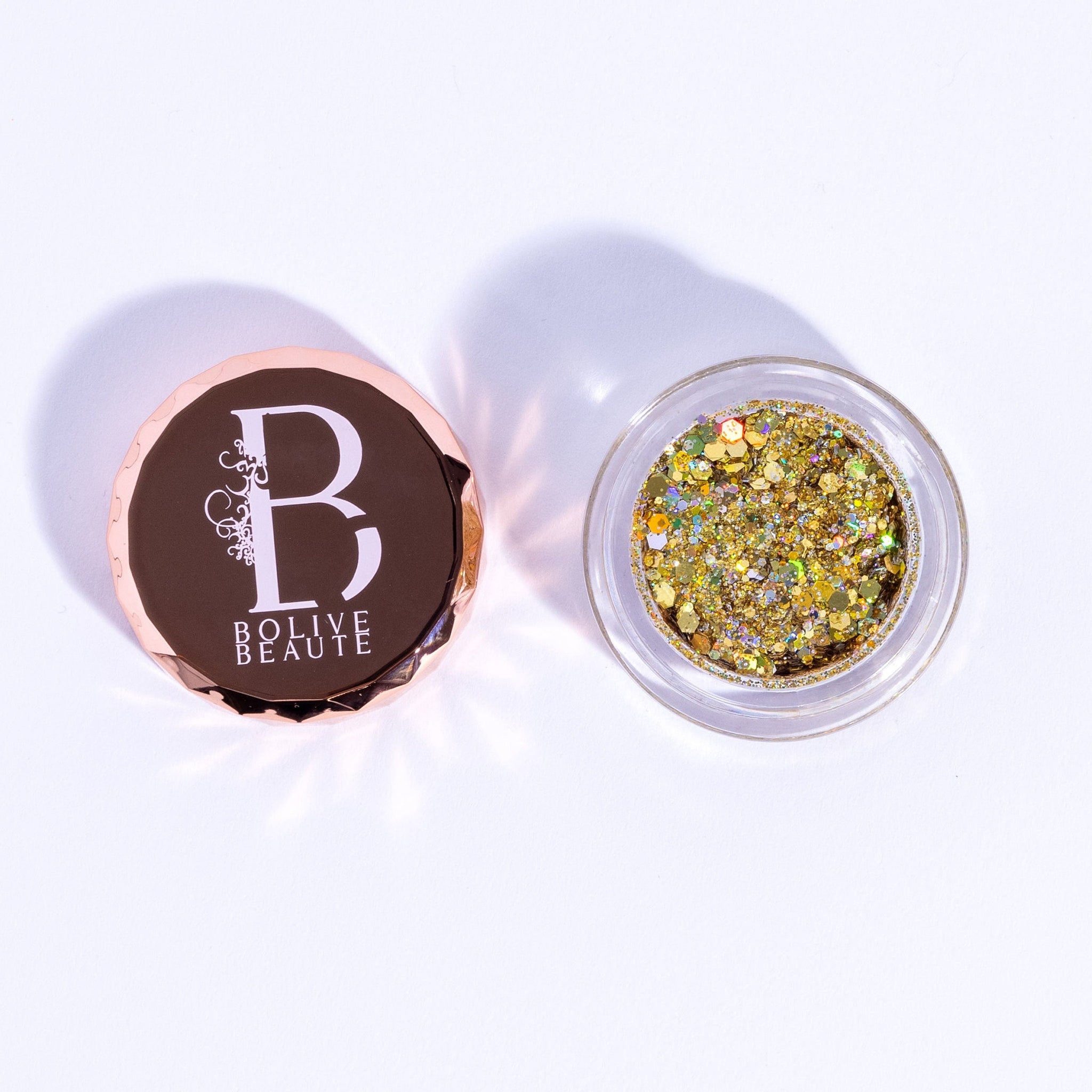 True Gold Glitter Eyeshadow pot with intense metallic shimmer and golden sparkle particles