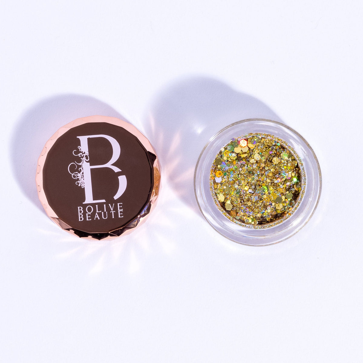 True Gold Glitter Eyeshadow pot with intense metallic shimmer and golden sparkle particles