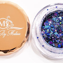 Side view of indigo and deep purple glitter eyeshadow duo showing shimmer texture and compact size