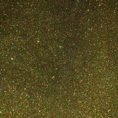 Close-up of holographic gold glitter eyeshadow pan showing shimmering multi-dimensional flecks