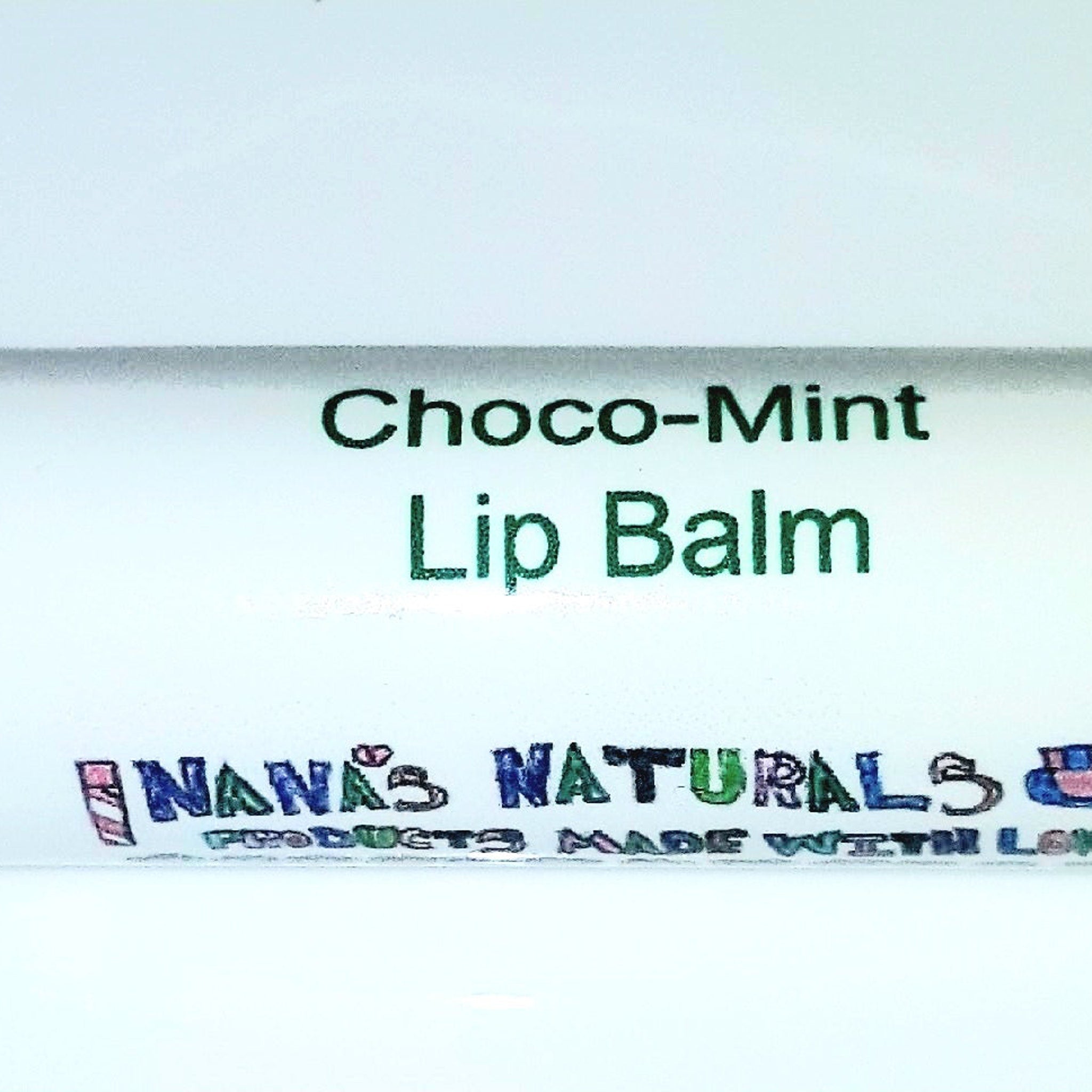 Lip balm with green and black text on a white background, "Nana's Naturals" brand visible