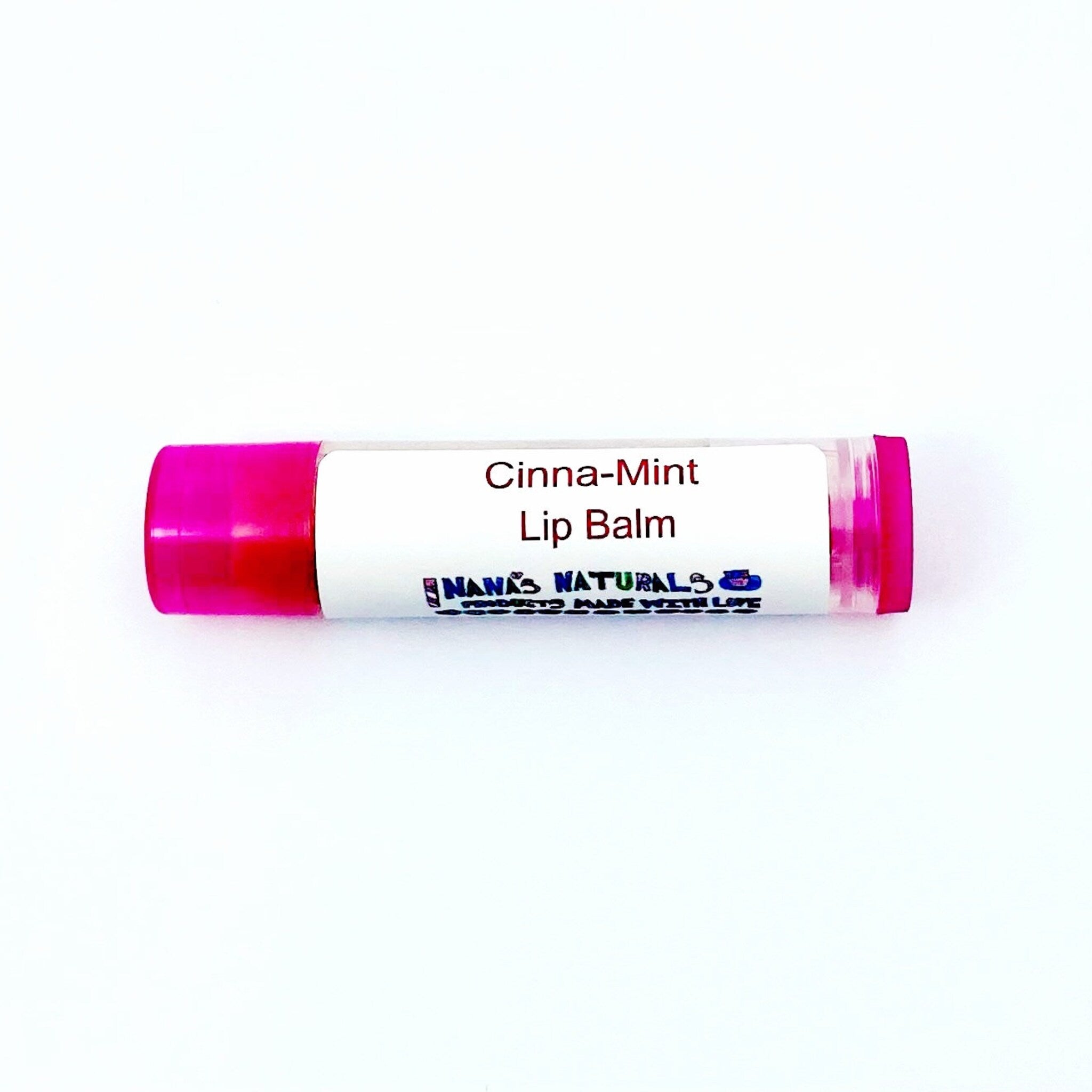 Lip balm tube with pink cap, white label, and "NANAS NATURALS" text visible