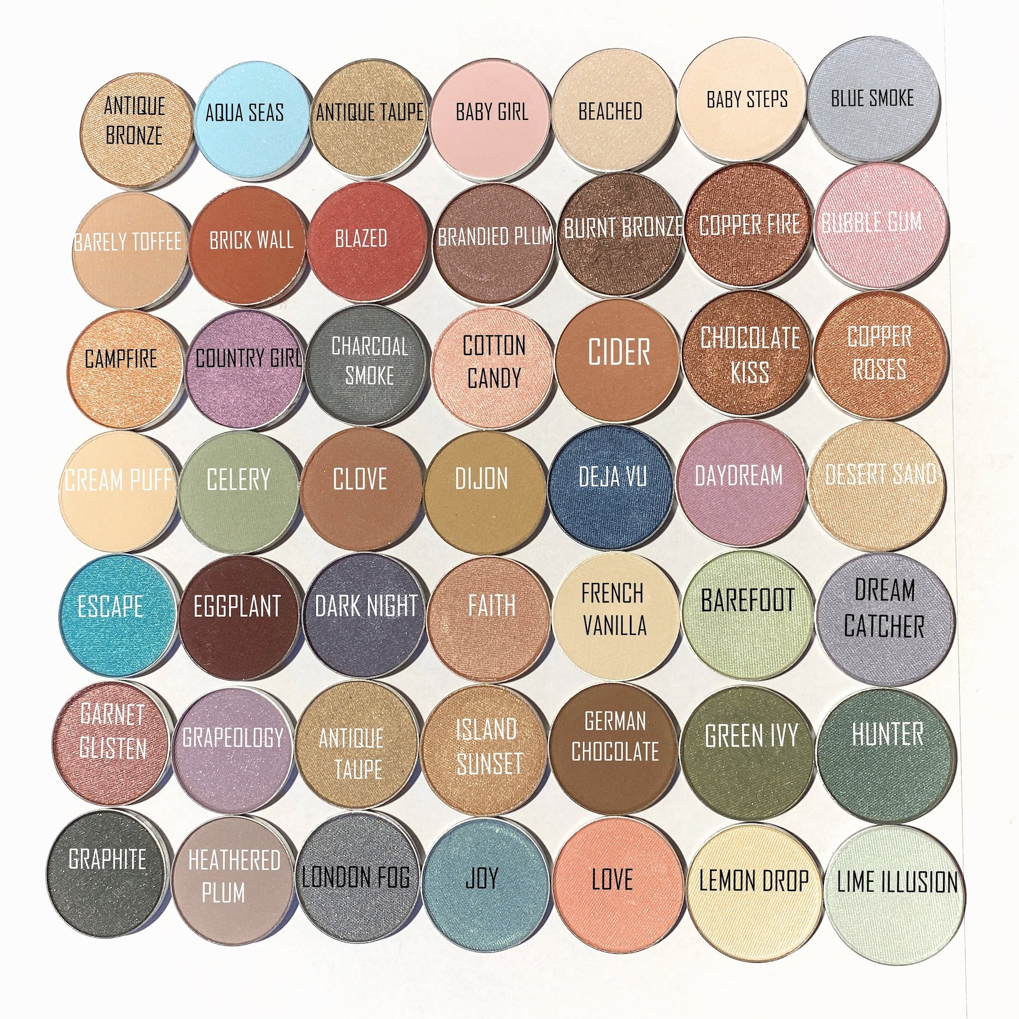Eyeshadow palette with various colors, round pans, and text labels for each shade