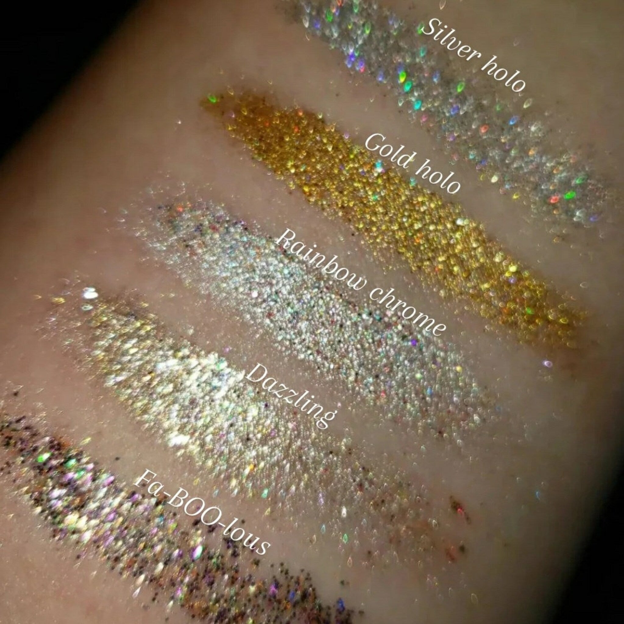Side view of shimmering loose glitter eye shadow pot with iridescent particles catching light
