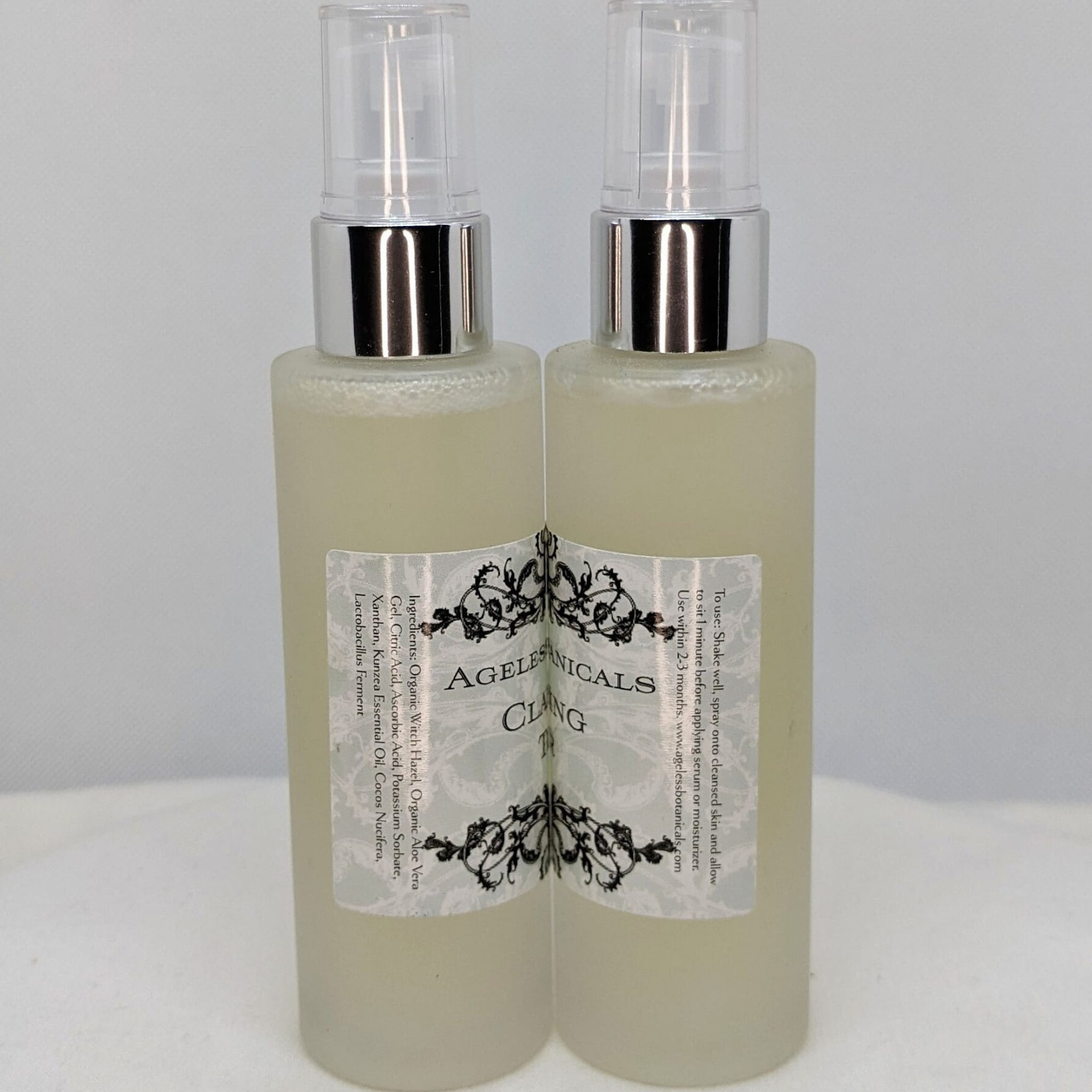 Facial spray bottles with silver tops, clear liquid, and brand label, Ageless Botanicals Clang