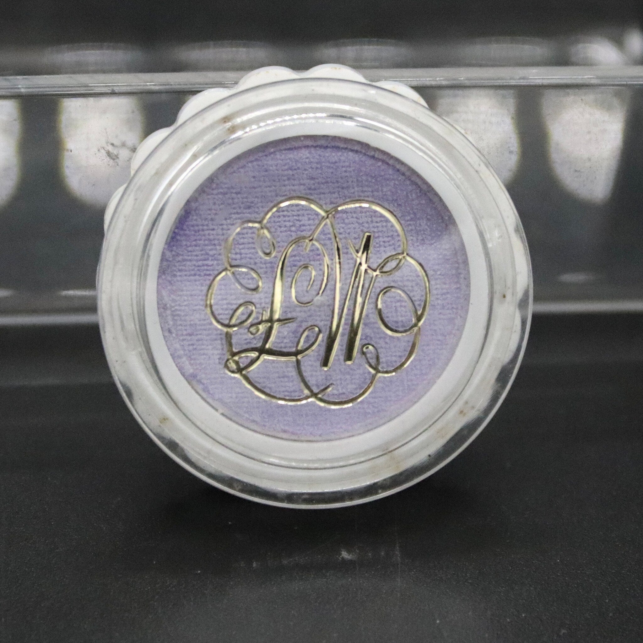 Eye shadow in aquamauve with gold lettering, in a clear plastic compact with white rim, Max Factor brand