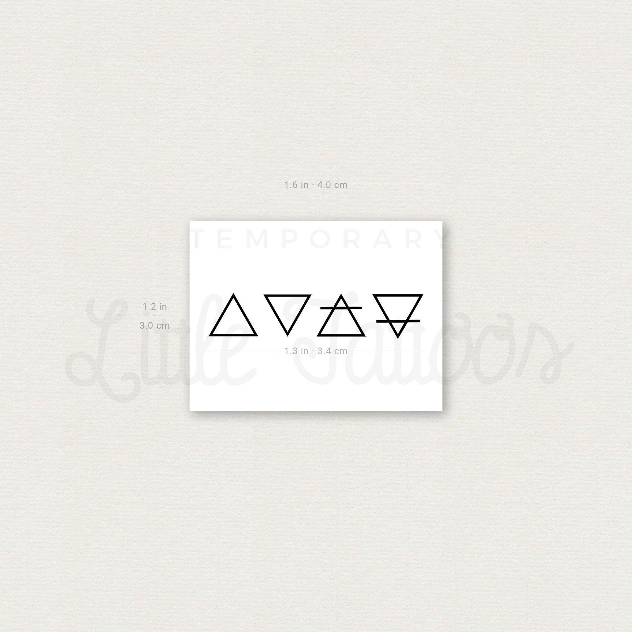 Temporary tattoo set with black geometric symbols on white backing, brand name visible