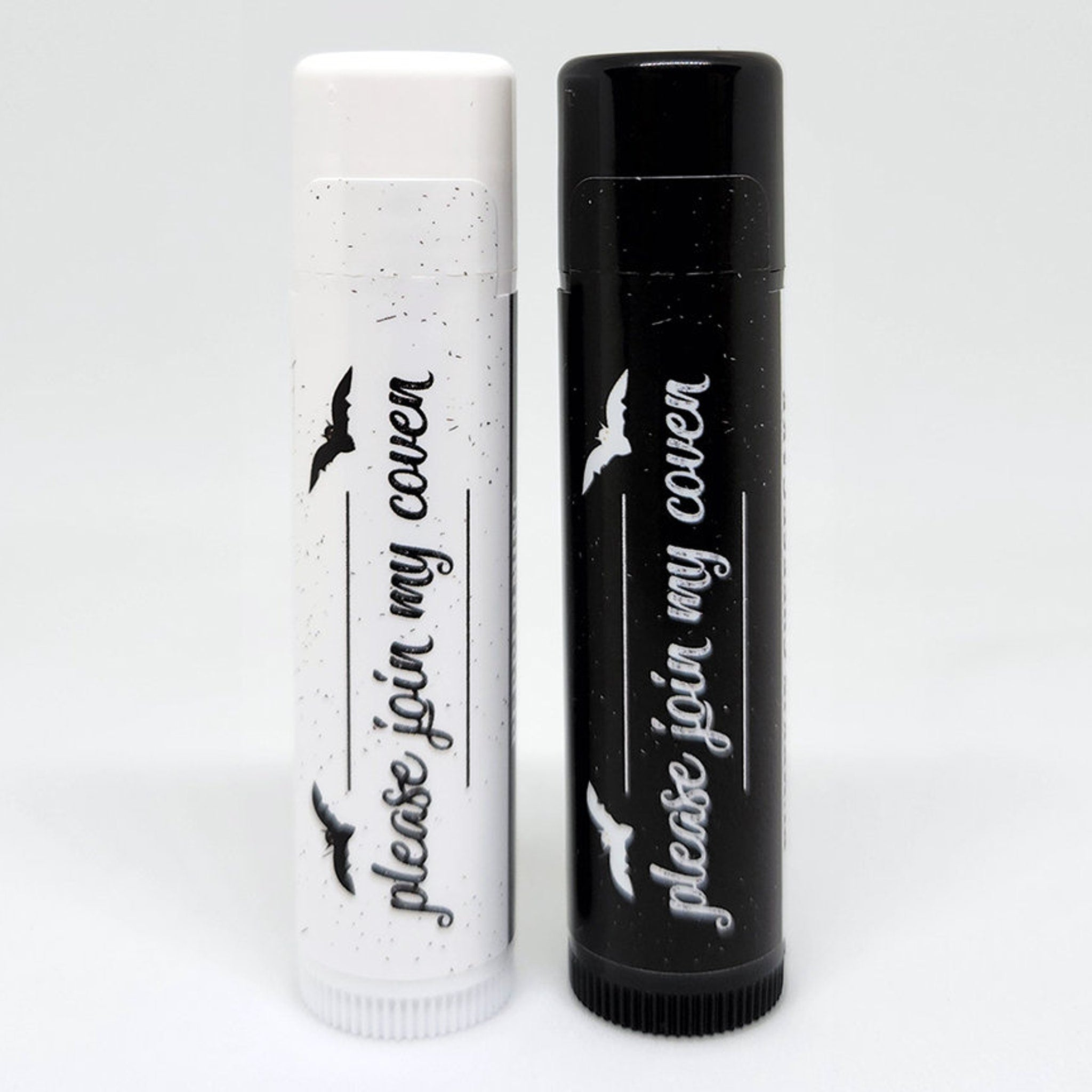 Lip balm tubes with black and white speckled design, text "please join my coven", bat illustrations