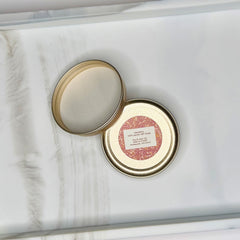 Jar lid with gold rim, pink label, and white interior, Hue & Lather LLC text visible
