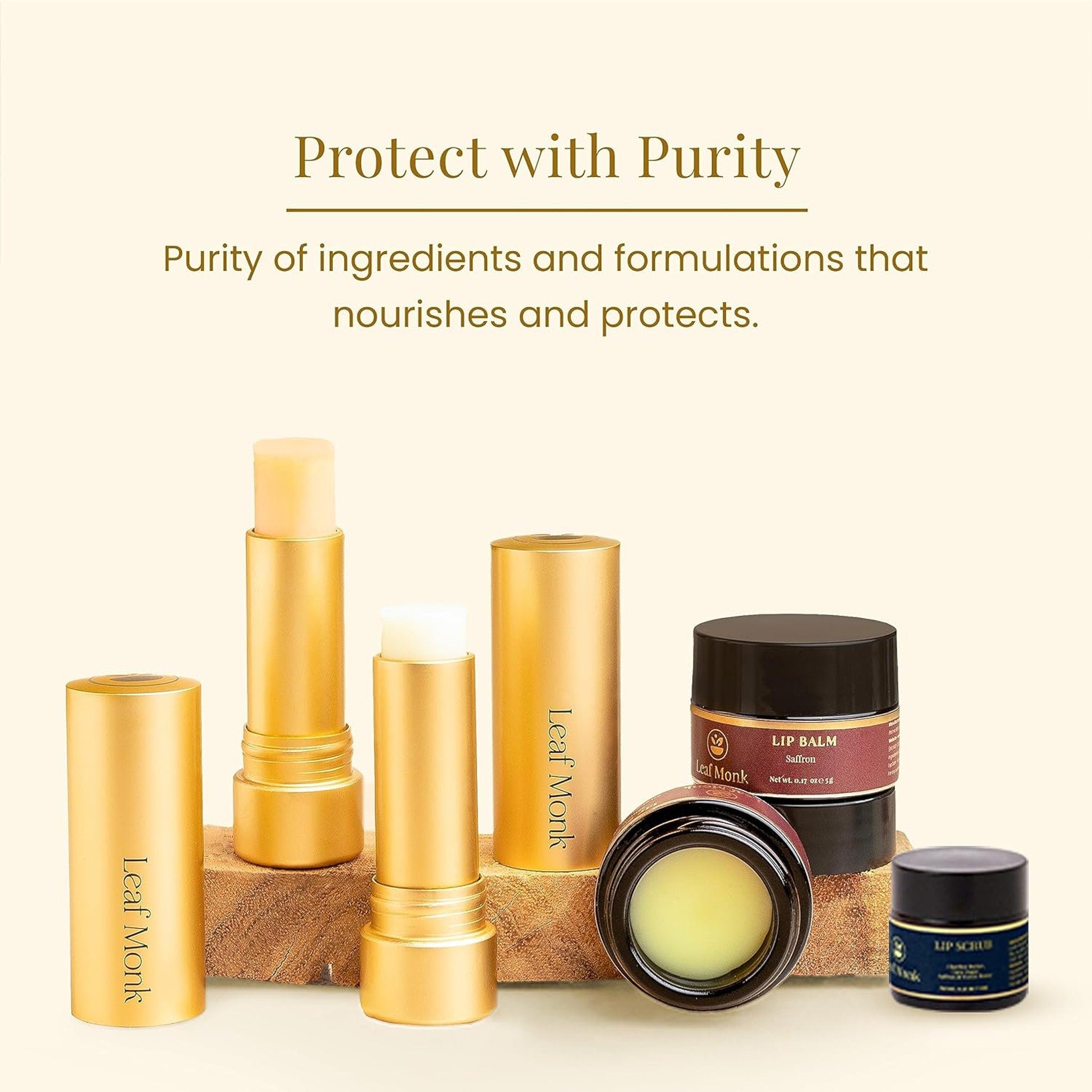 Lip balm and lip scrub in golden and black containers, Leaf Monk brand visible