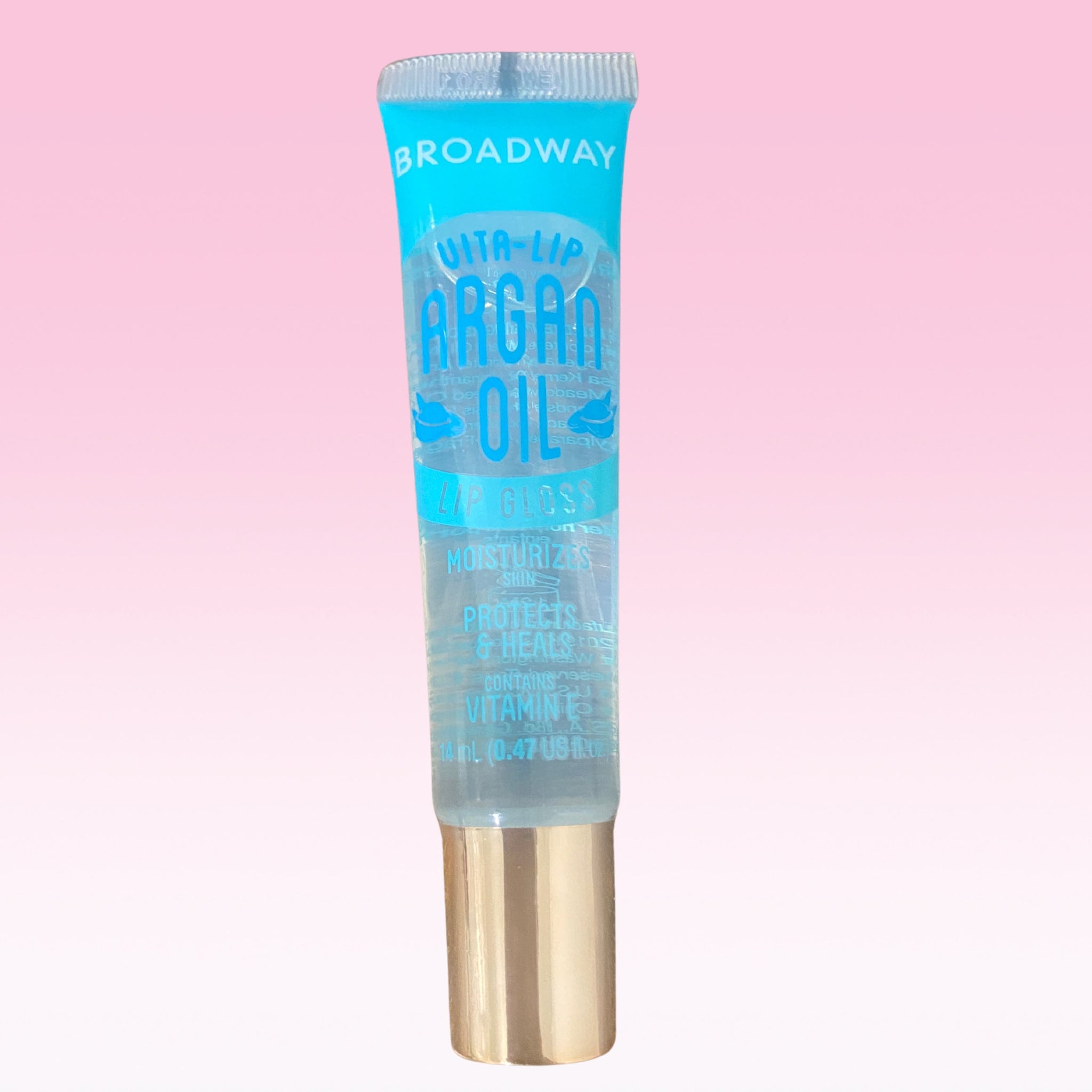 Lip gloss tube with blue and gold accents, Broadway Vita Soft brand visible, for lip care