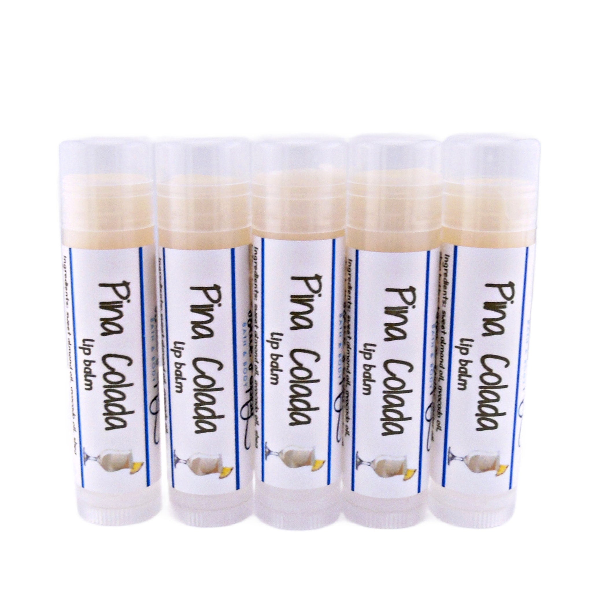 Lip balm tubes with white labels, Pina Colada text, and clear plastic caps.