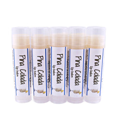 Lip balm tubes with white labels, Pina Colada text, and clear plastic caps.