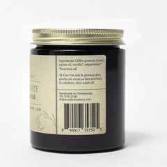 Body scrub jar with black glass, gold lid, and product label, for exfoliation