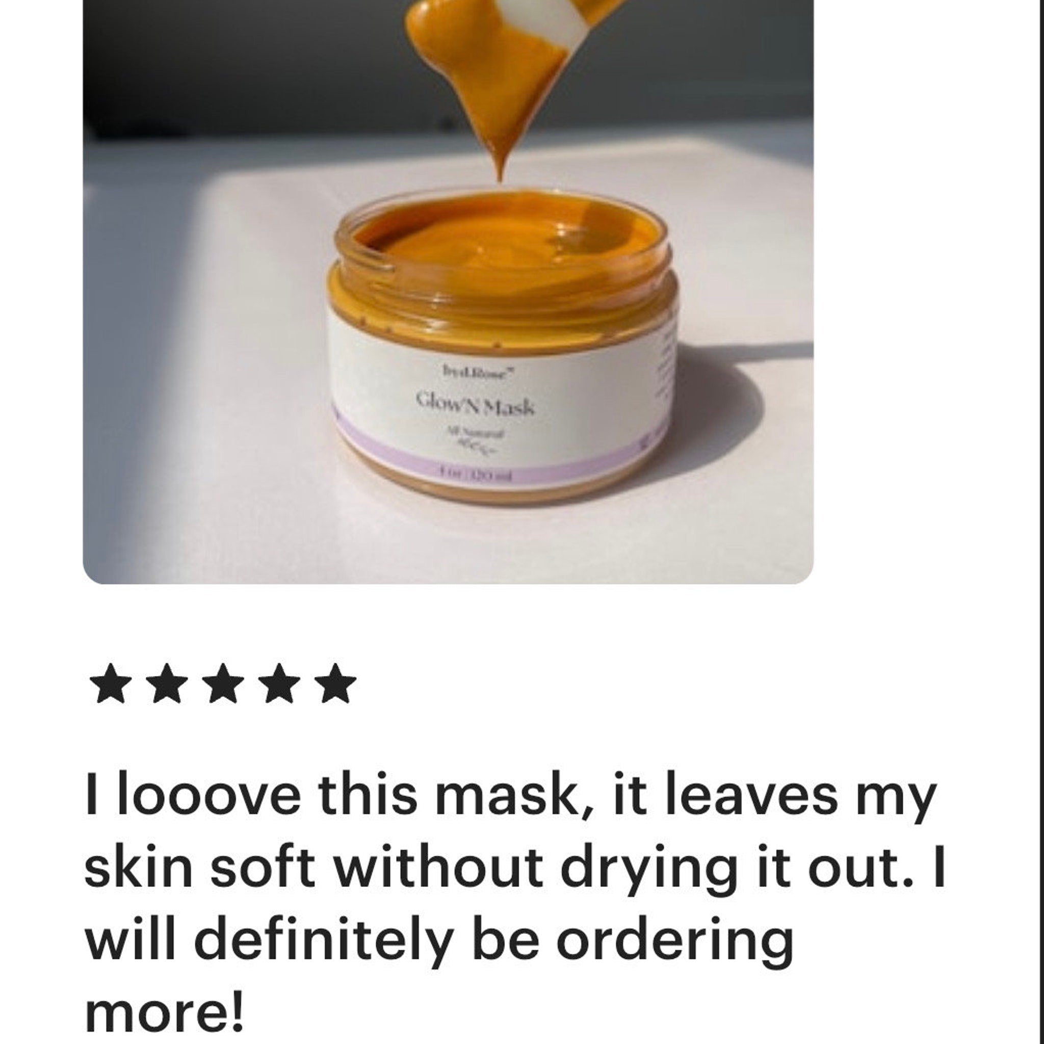 Glow N Mask jar with orange contents and white label, by brillone, with product being applied