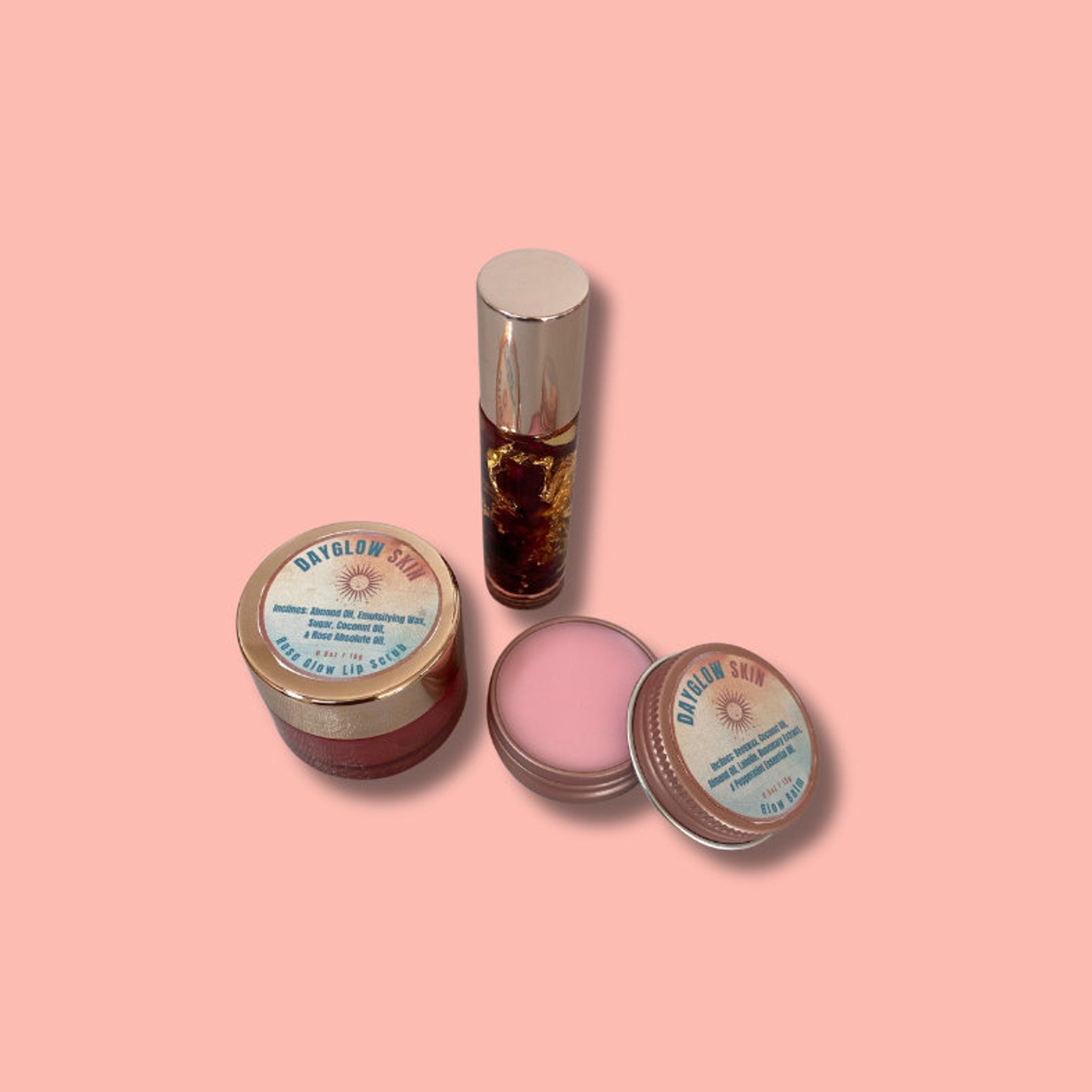 Lip care products in pink, gold, and silver containers with Dayglow Skin branding visible on labels