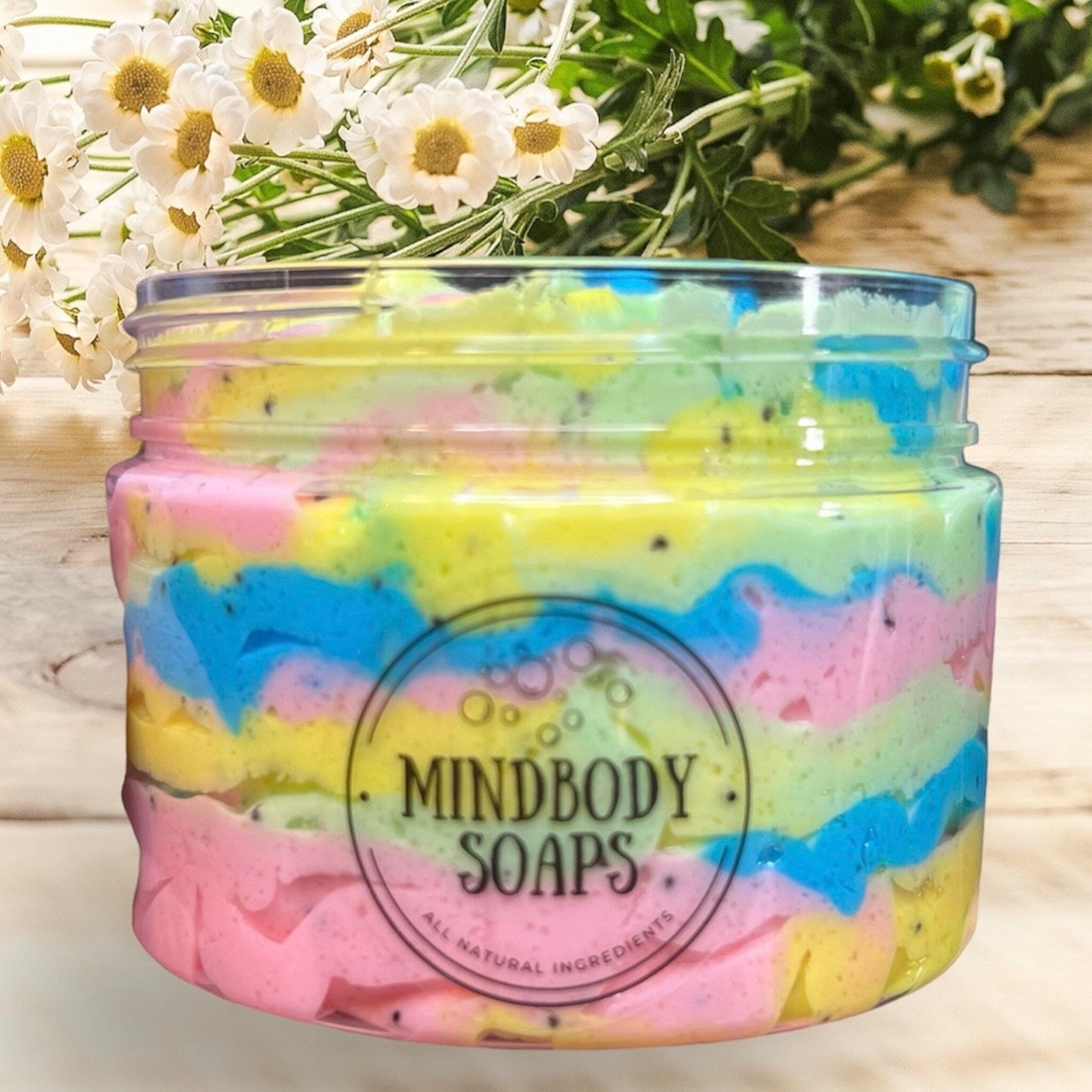 Colorful soap jar with pastel colors, Mindbody Soaps brand, and natural ingredients visible in image